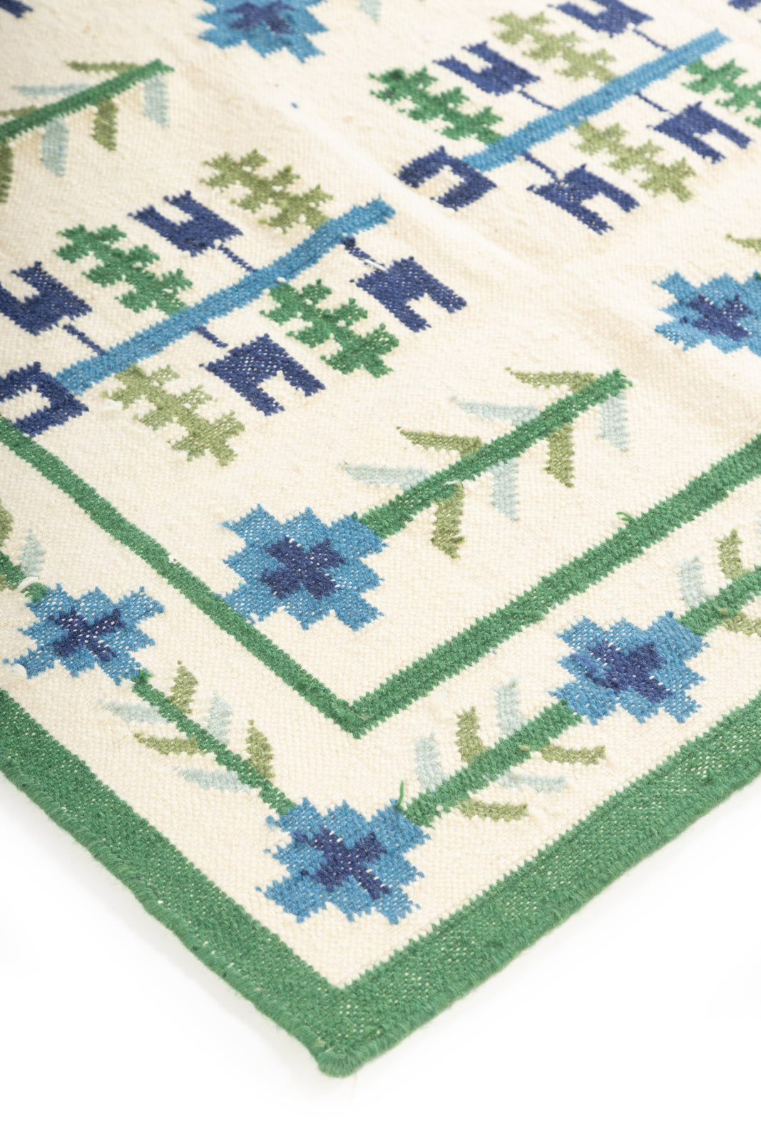 Celestial Garden Flatweave Rug close-up showing the wool pile and floral motif