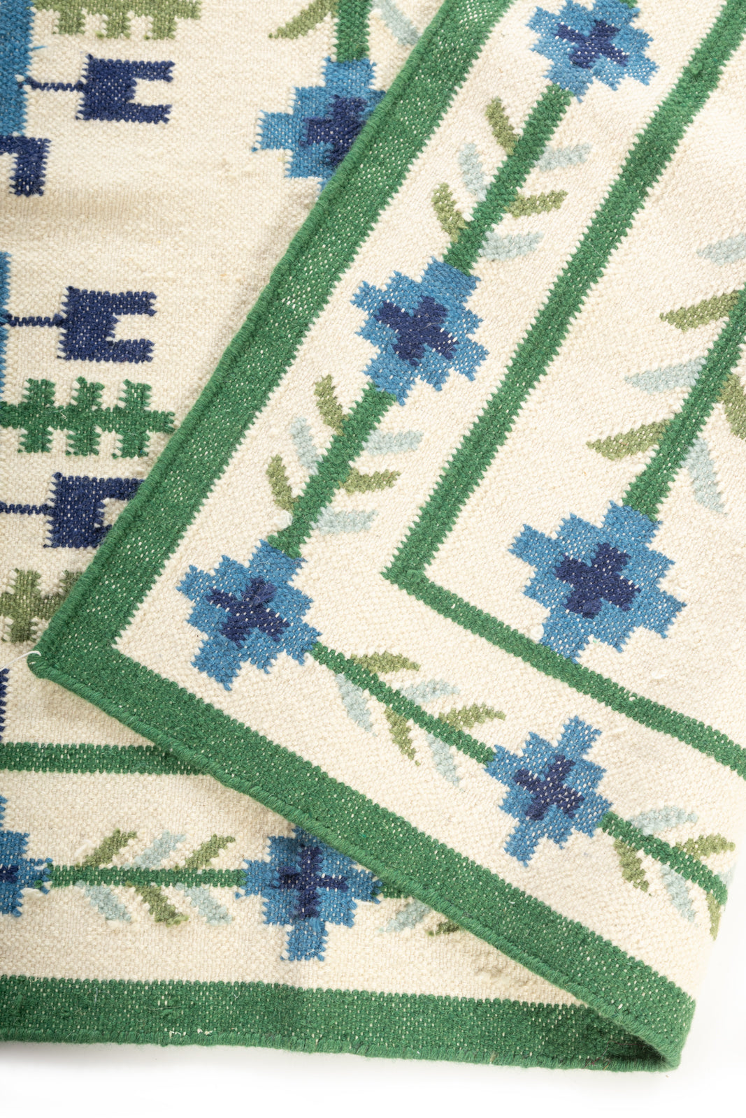 Celestial Garden Flatweave Rug detail of the floral motif in wool cut pile