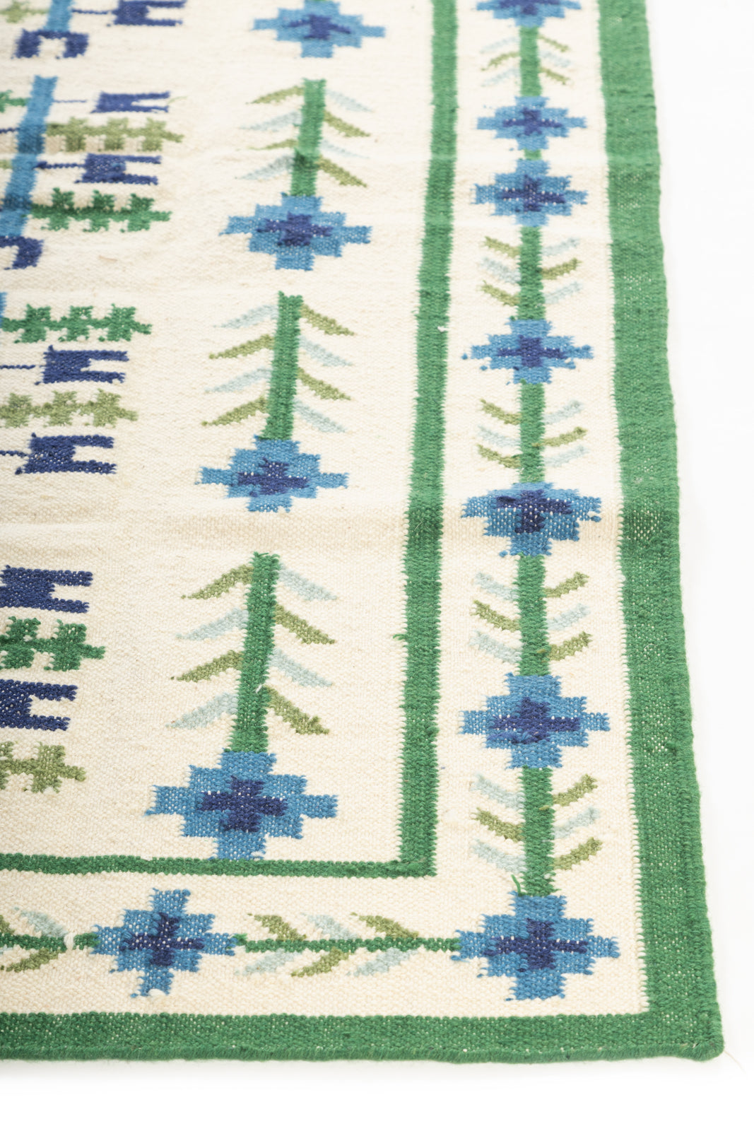 Celestial Garden Flatweave Rug wool rug styled in a living room interior