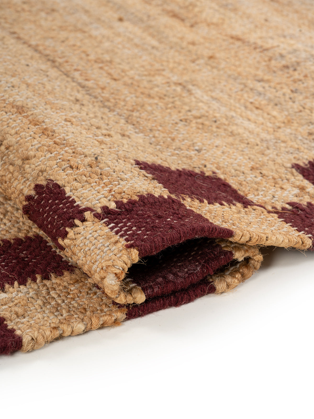 Checkerboard Border Jute Runner - jute runner laid in a hallway view