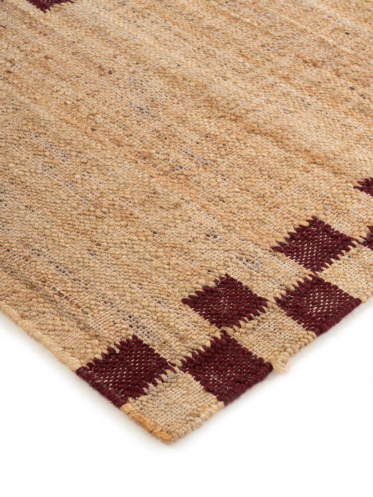 Checkerboard Border Jute Runner close-up showing the jute weave and geometric surface