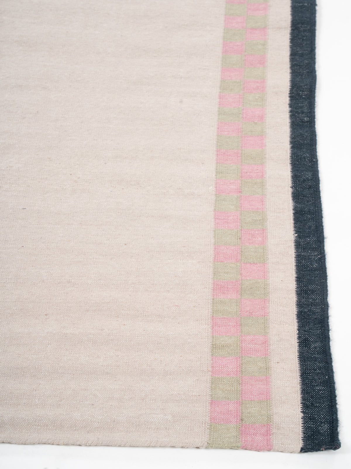Checkerboard Stream Runner-Beige - cotton runner laid in a hallway view