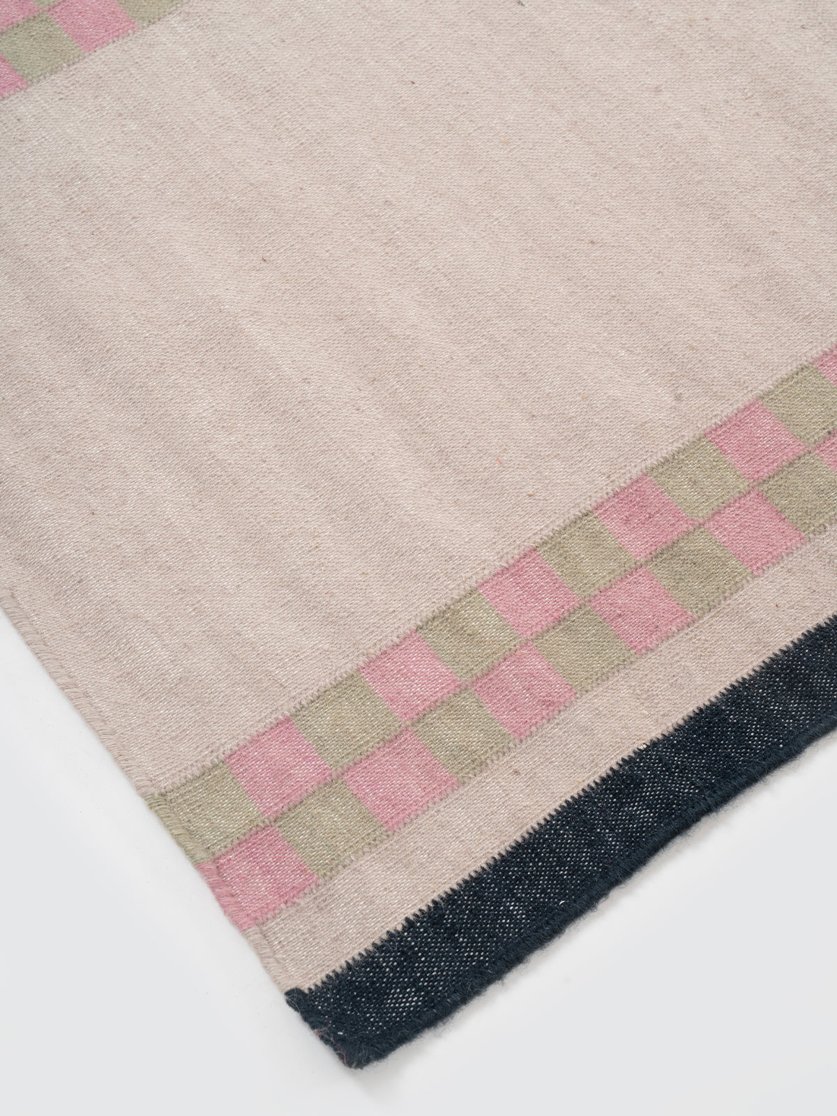 Checkerboard Stream Runner-Beige close-up showing the cotton weave and geometric surface