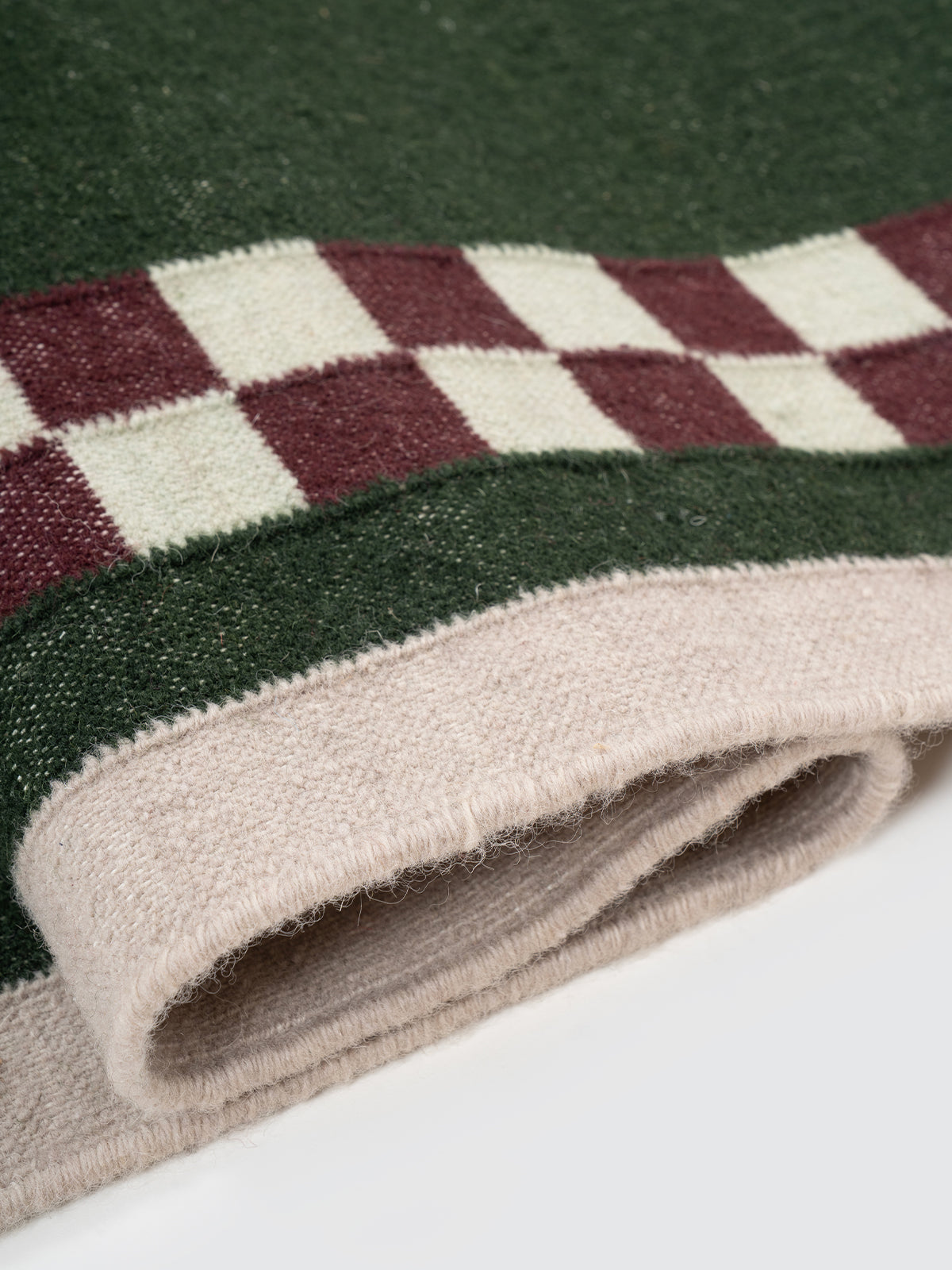 Checkerboard Stream Runner-Sage - cotton runner laid in a hallway view