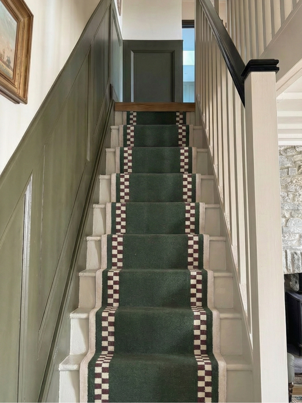 Checkerboard Stream Runner-Sage cotton stair runner styled on a staircase in a designed interior