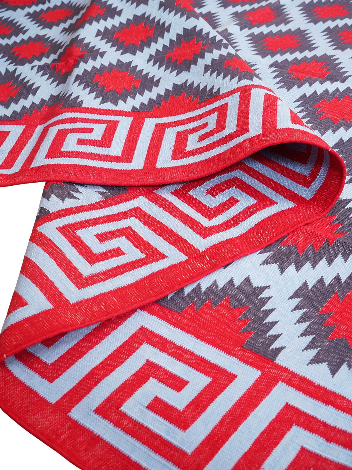 Cherry hellenic Flatweave rug detail of the striped cotton surface and edge finishing
