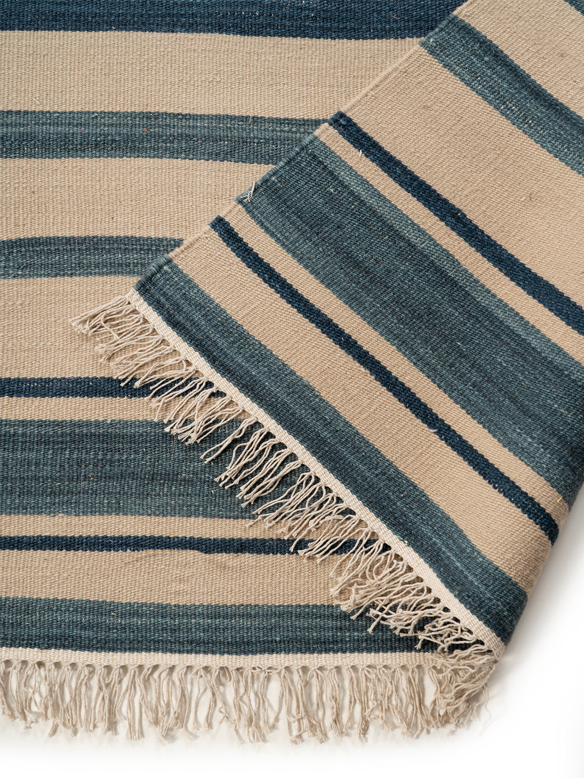 Coastal Stripe Flatweave Rug detail of the striped wool surface and edge finishing