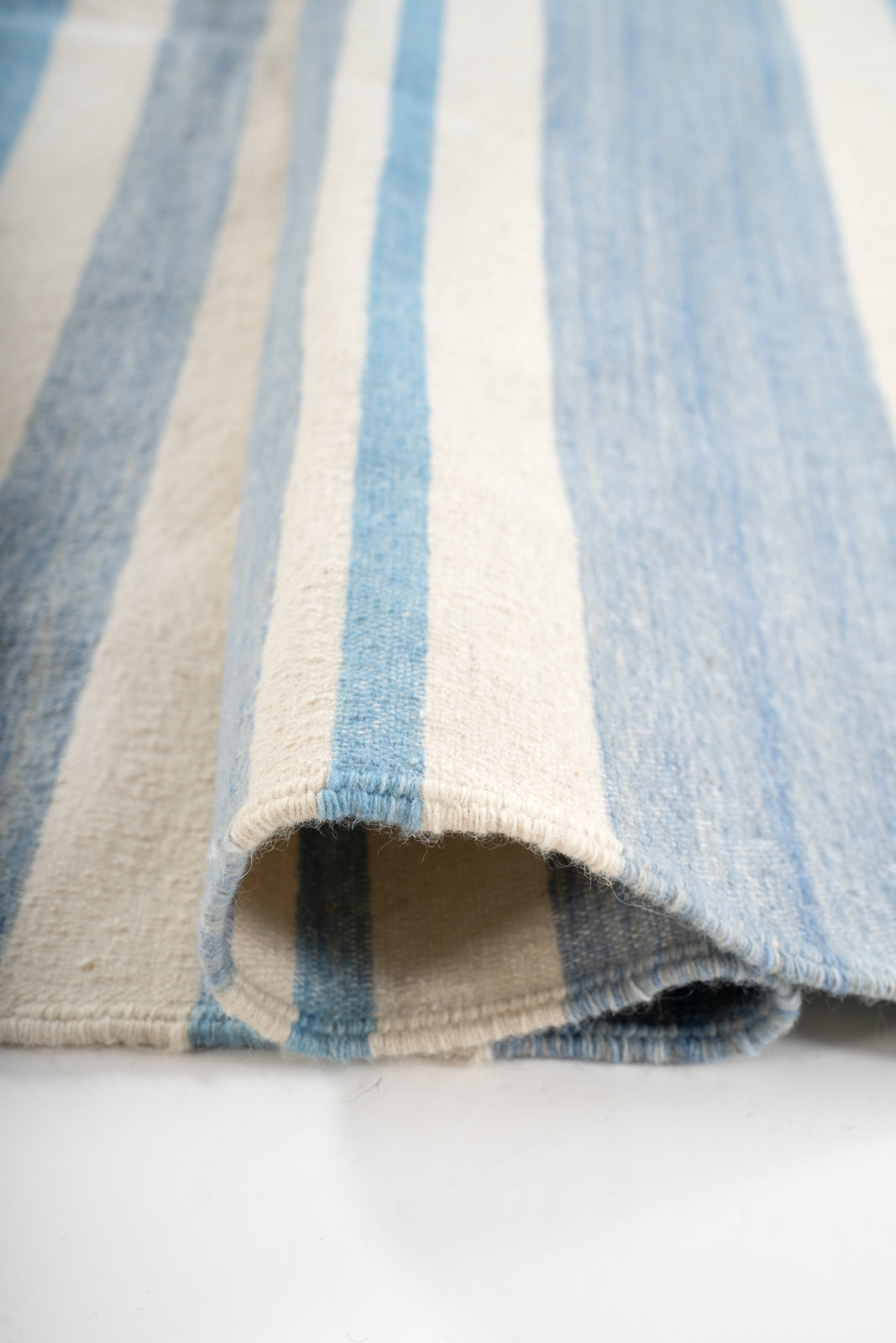 Coimbatore Cascade Flatweave Rug - texture detail showing cotton surface