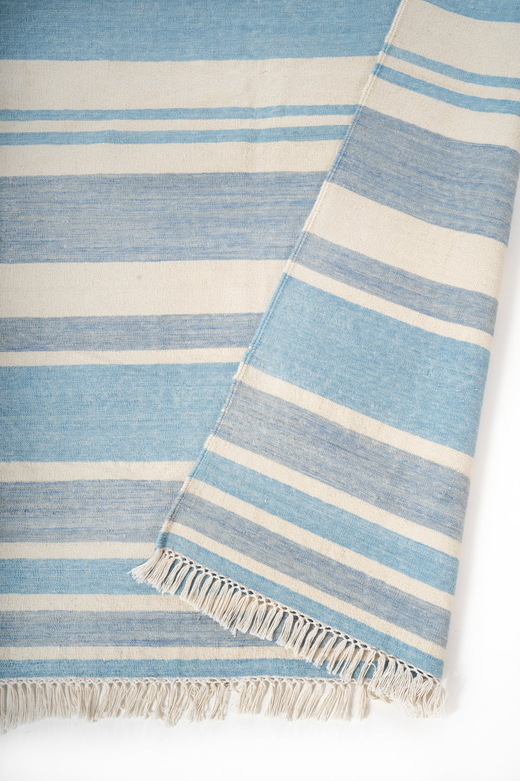 Coimbatore Cascade Flatweave Rug detail of the striped cotton surface and edge finishing
