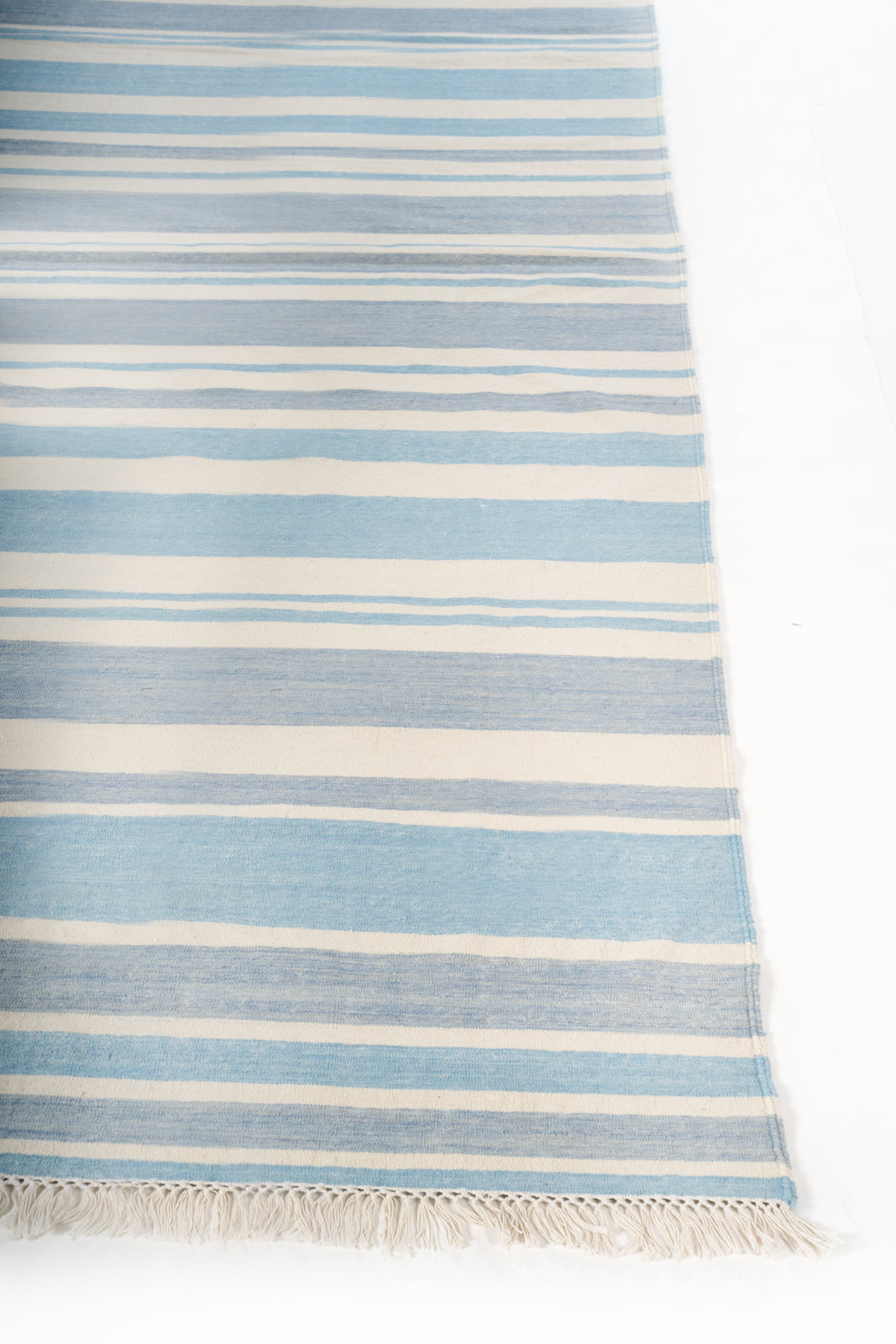 Coimbatore Cascade Flatweave Rug cotton rug styled in a living room interior