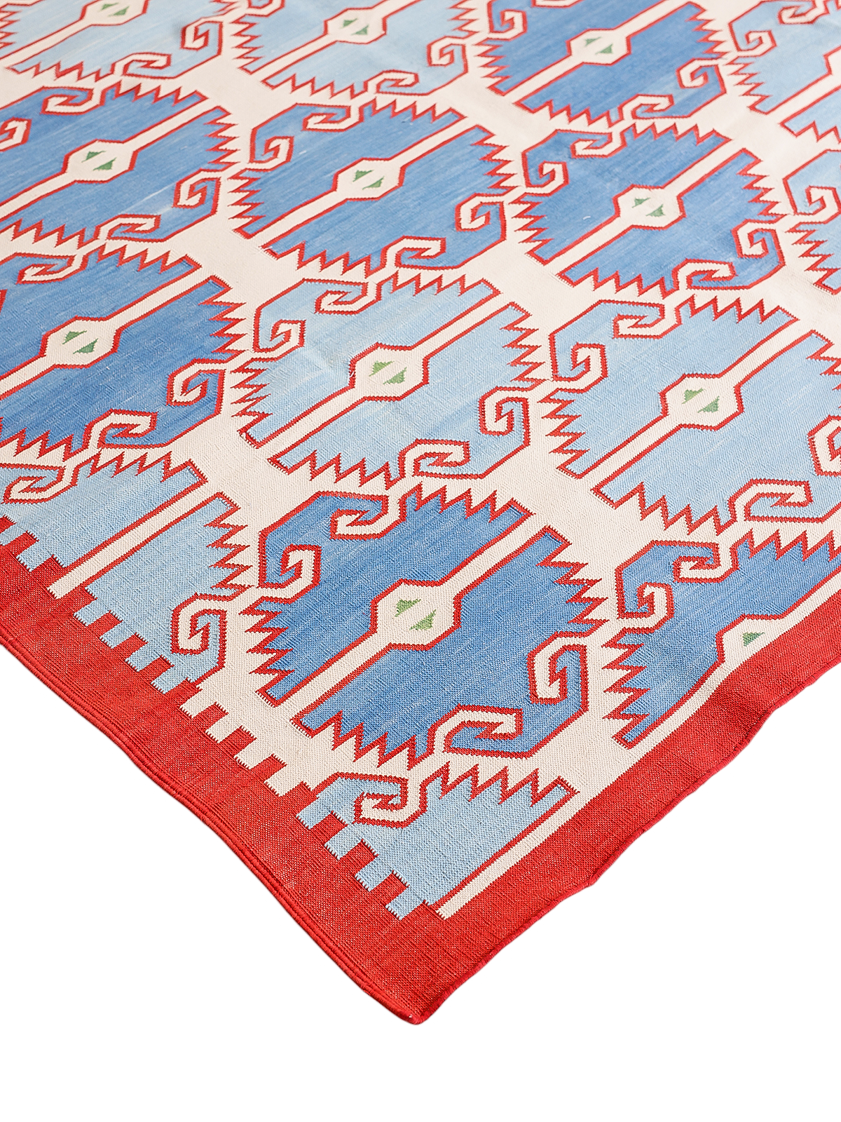 Coral Crest Cotton Flatweave Rug close-up showing the cotton weave and geometric motif