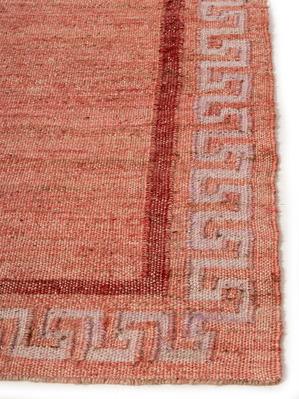 Coral Maze Jute Rug jute rug styled in a living room interior