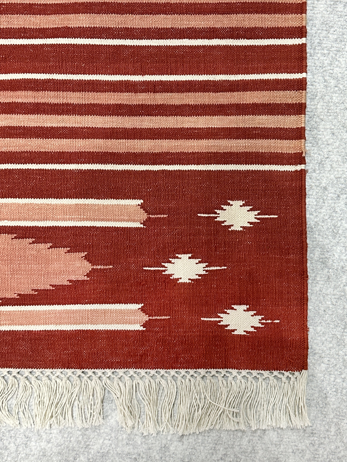 Crimson Bloom Kilim Cotton Rug close-up showing the cotton pile and floral motif