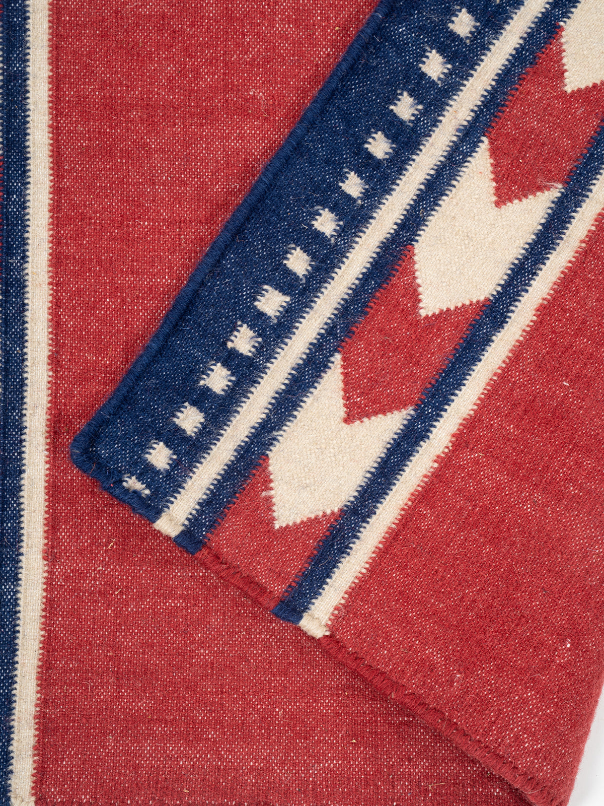 Crimson Moor Runner detail showing edge binding and cotton finishing of the runner