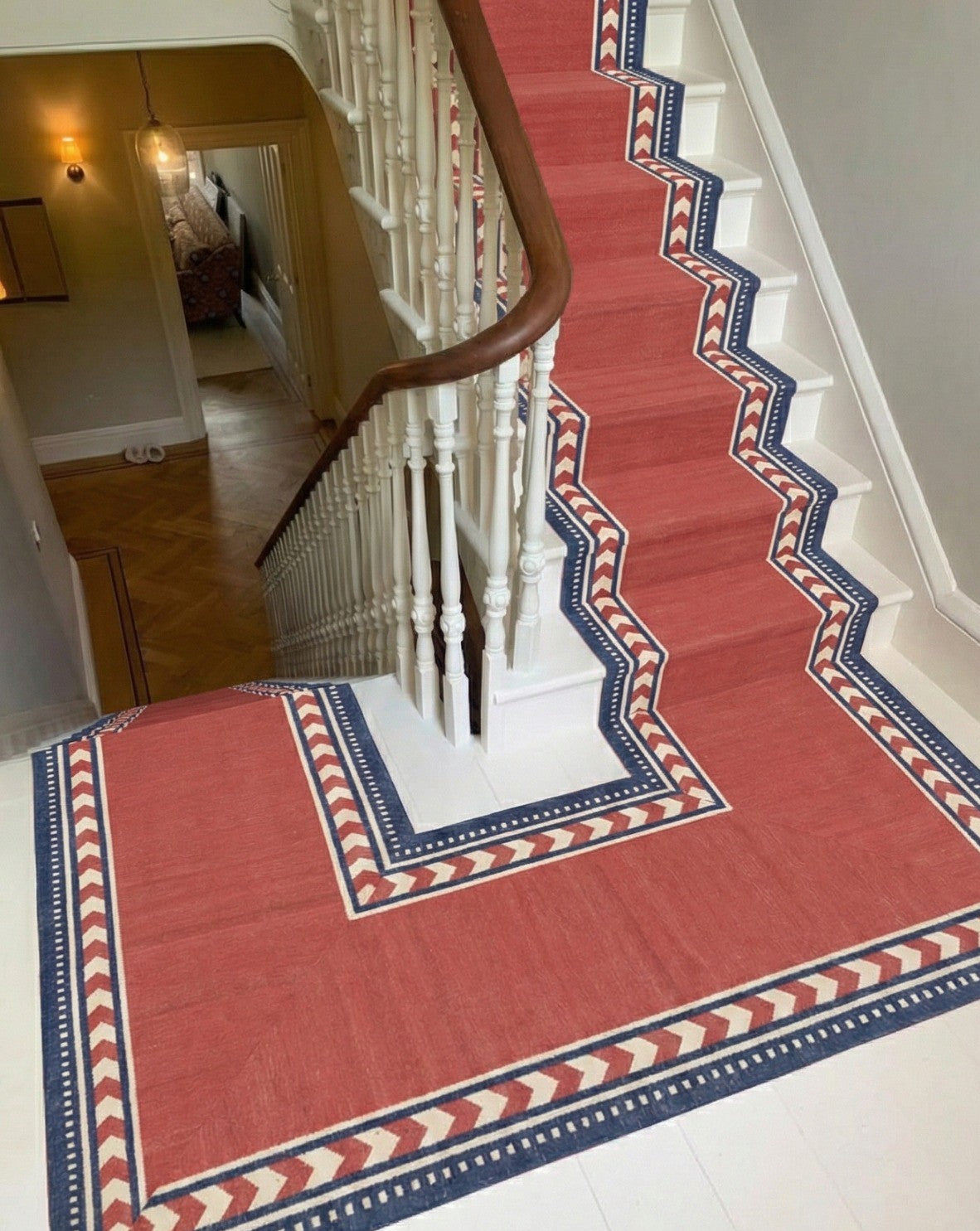 Crimson Moor Runner cotton stair runner styled on a staircase in a designed interior