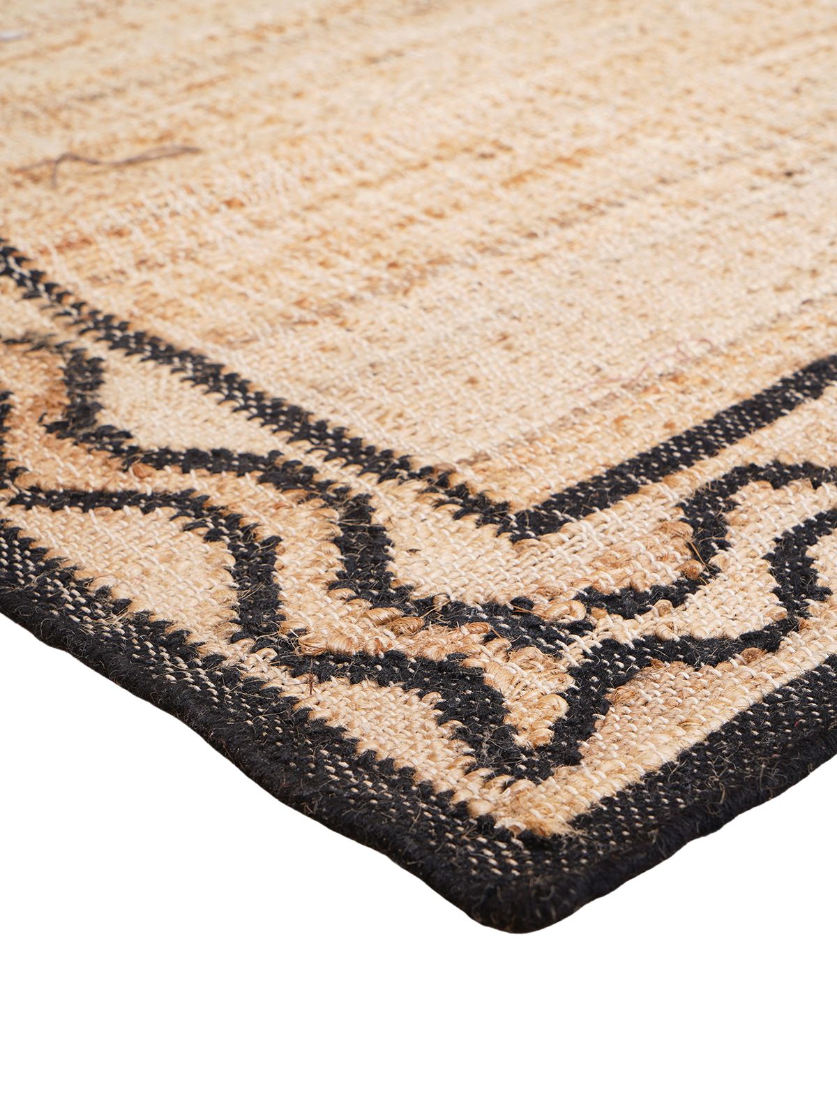 Dark Crest Double Wave Rug close-up showing the jute weave and geometric motif