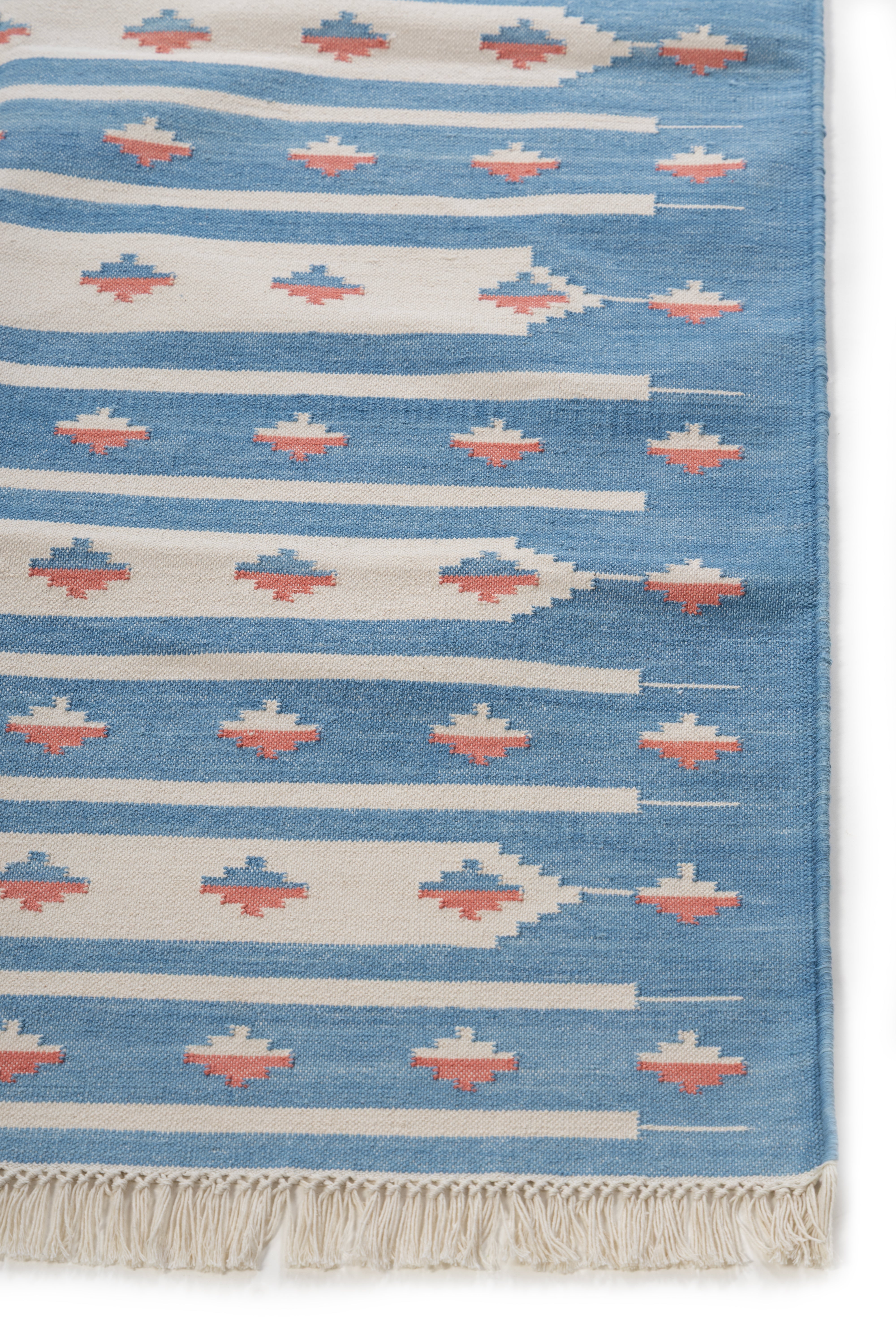 Desert Sky Kilim Dhurrie cotton rug styled in a living room interior