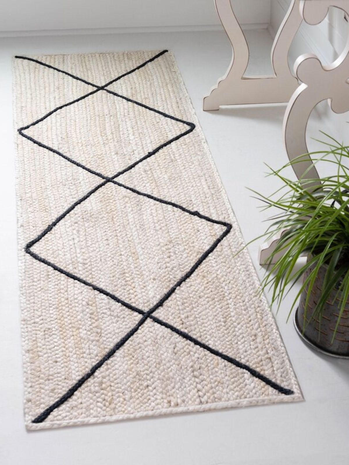 Dodoma Braided Runner cotton stair runner styled on a staircase in a designed interior