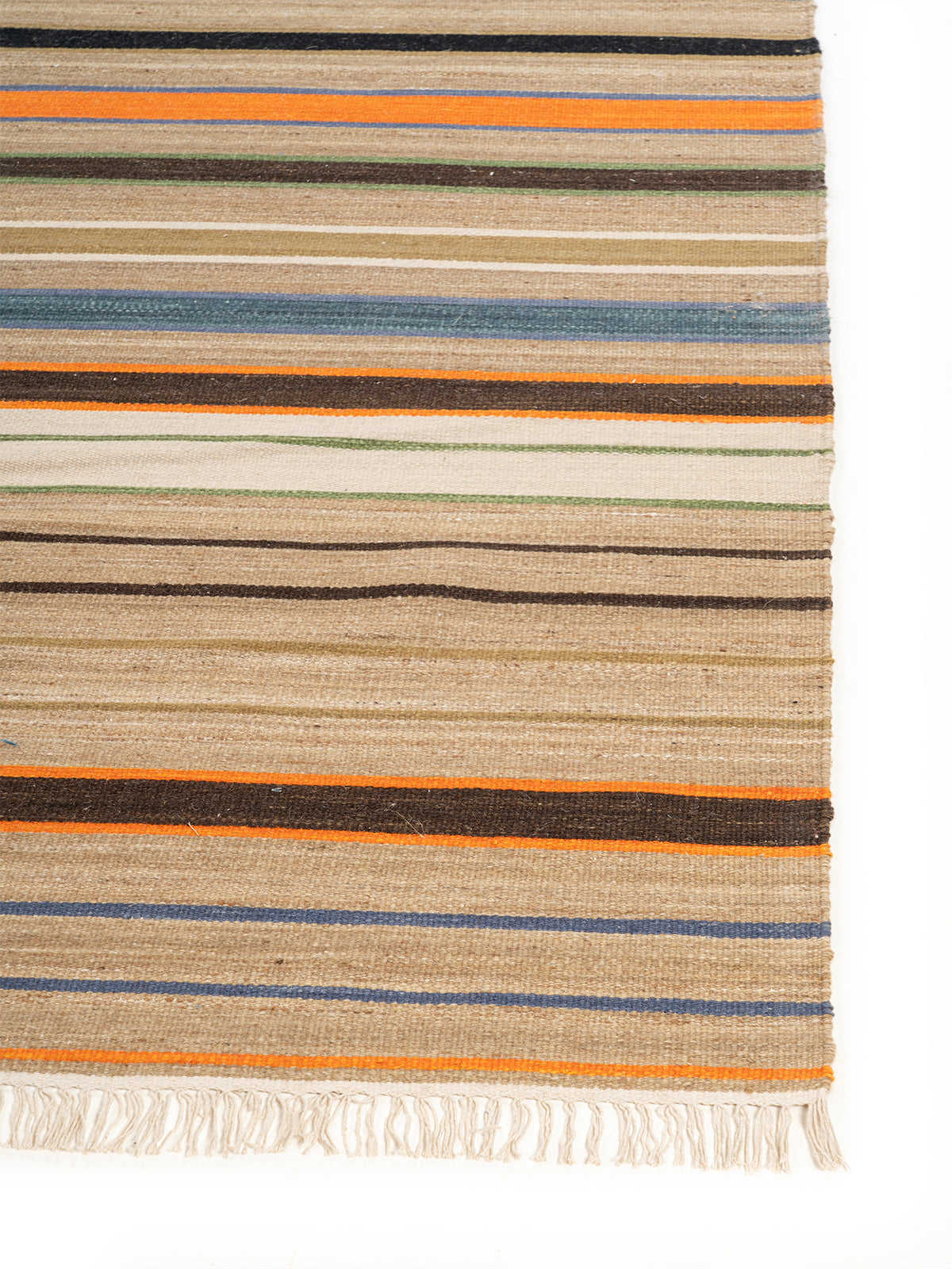 Earth Tone Stripe Flatweave Rug wool rug styled in a living room interior