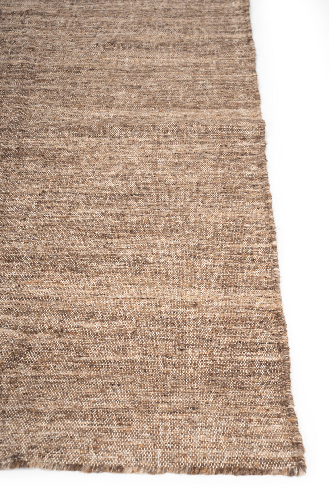 Earthen Essence Brown Wool Rug wool rug styled in a living room interior