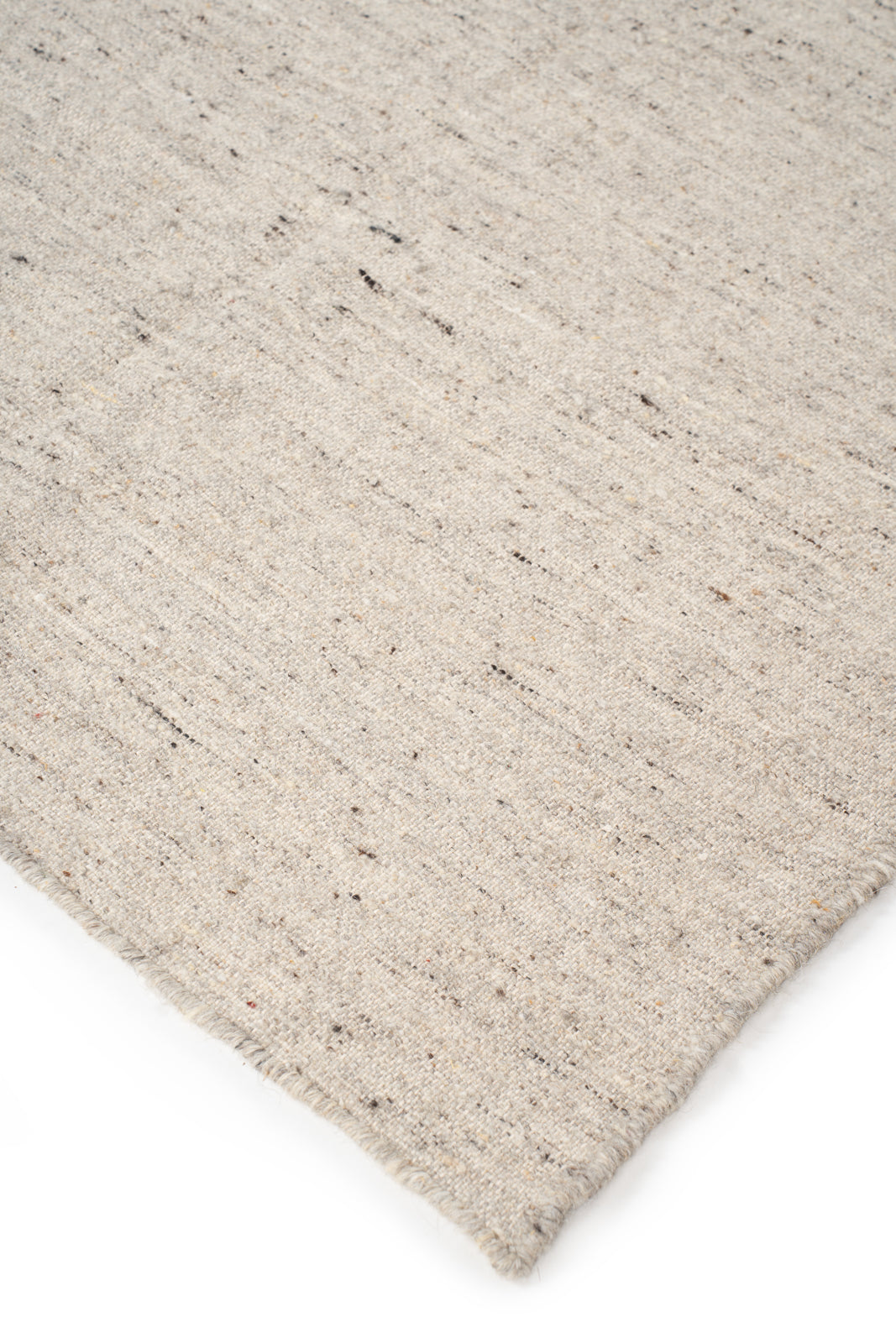 Earthen Essence Ivory Wool Rug close-up showing the wool weave and surface texture