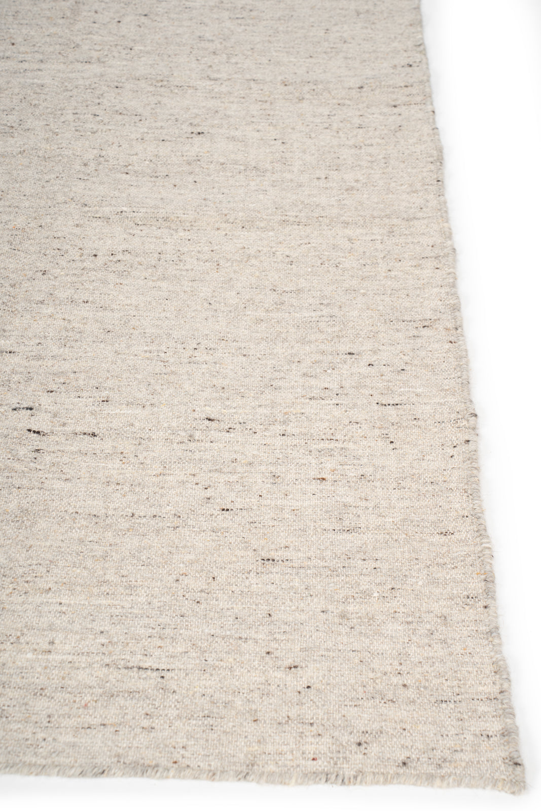 Earthen Essence Ivory Wool Rug wool rug styled in a living room interior