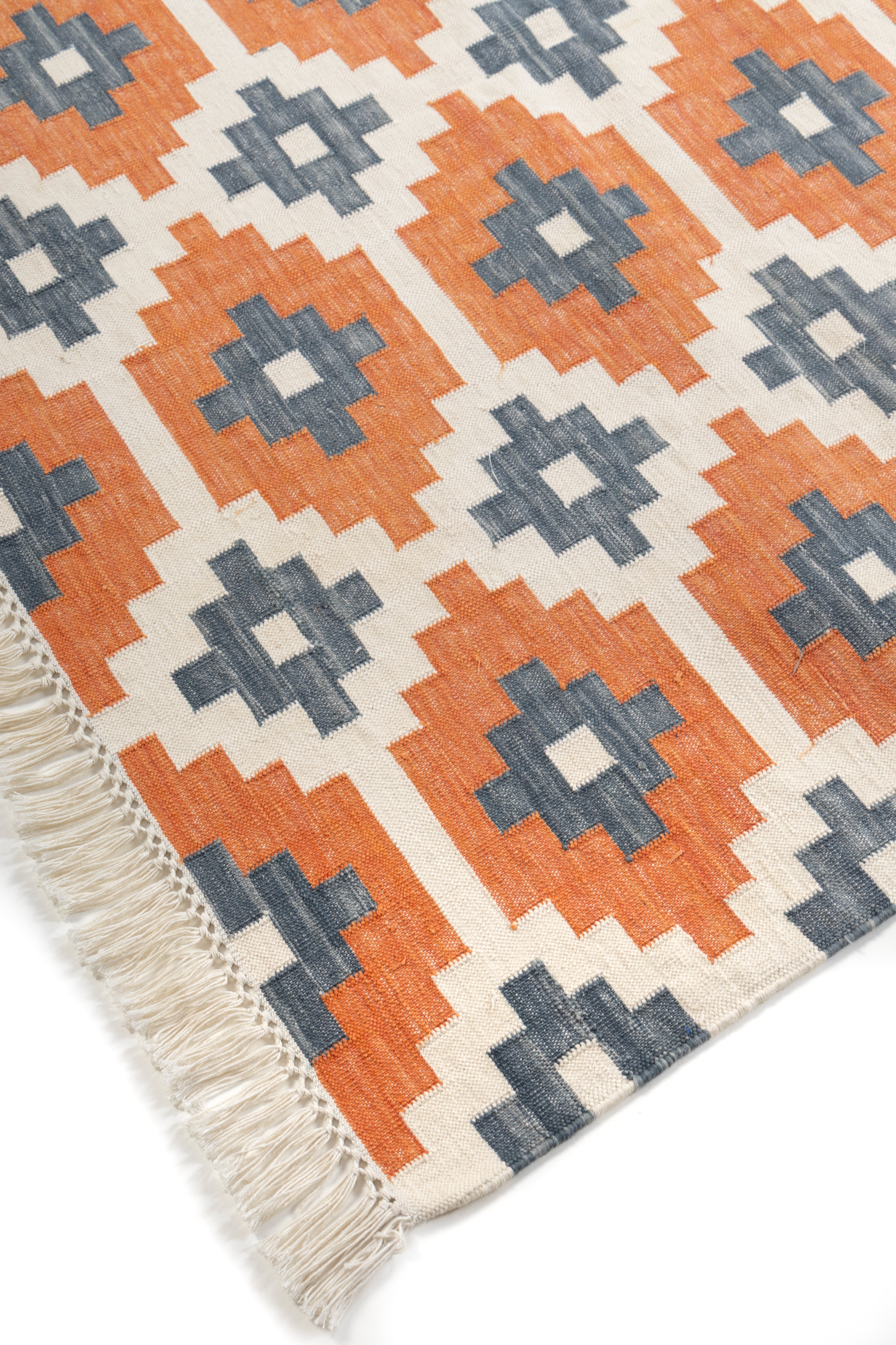 Ember Echo Kilim Rug close-up showing the cotton weave and geometric motif