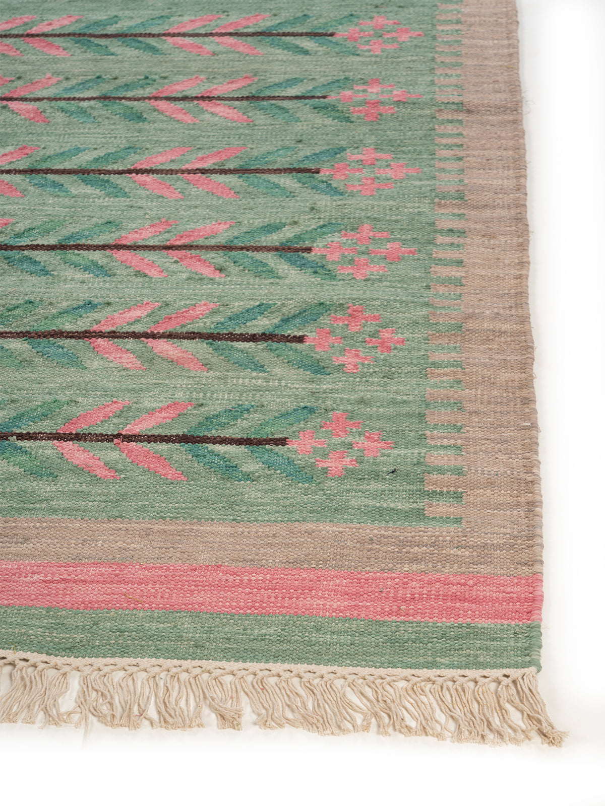 Folk Botanical Flatweave Rug wool rug styled in a living room interior