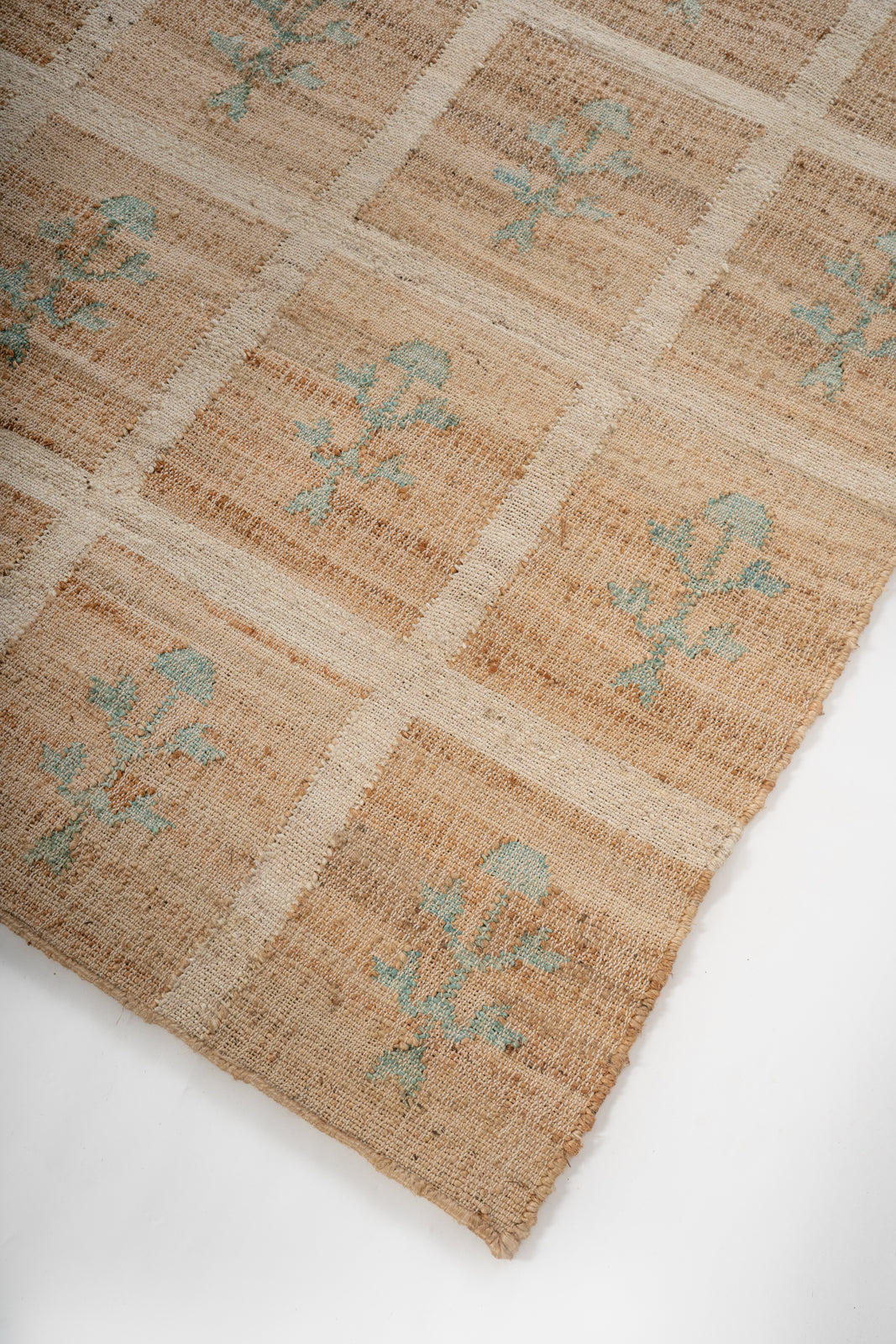 Forest Grid Jute Rug close-up showing the jute weave and geometric motif