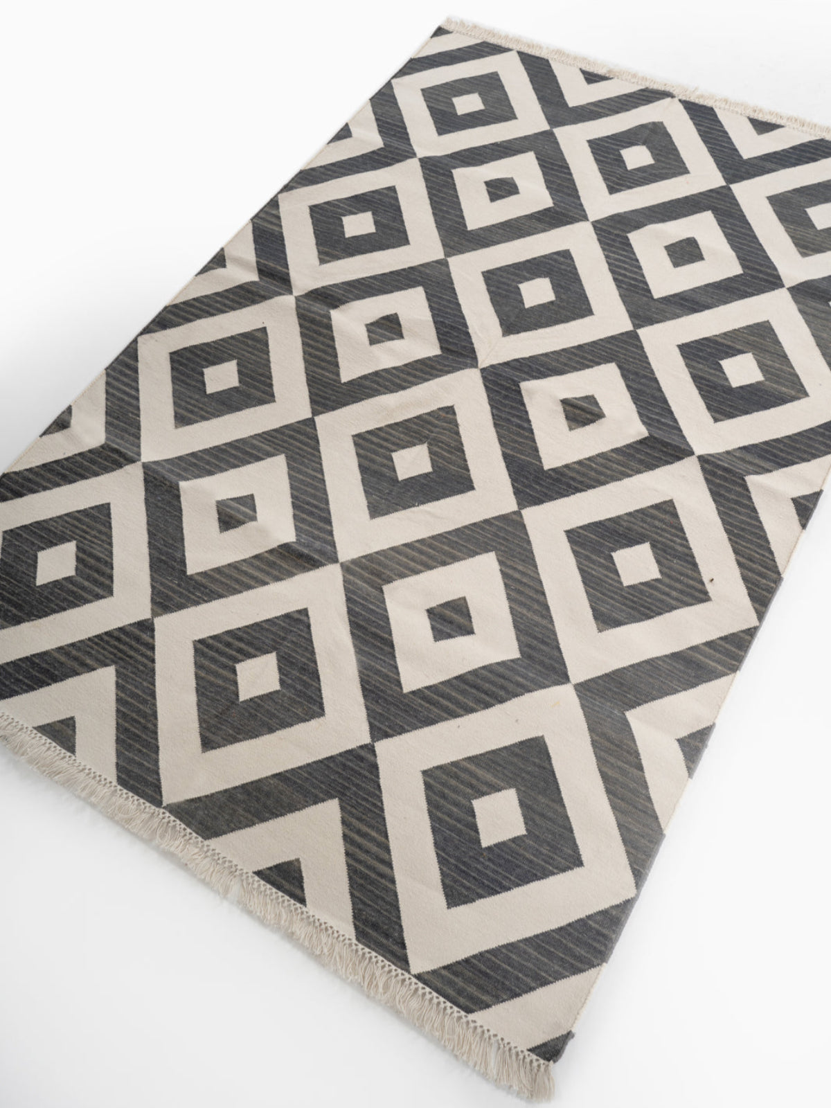 Geometric Diamonds Flatweave Cotton Rug cotton rug styled in a living room interior