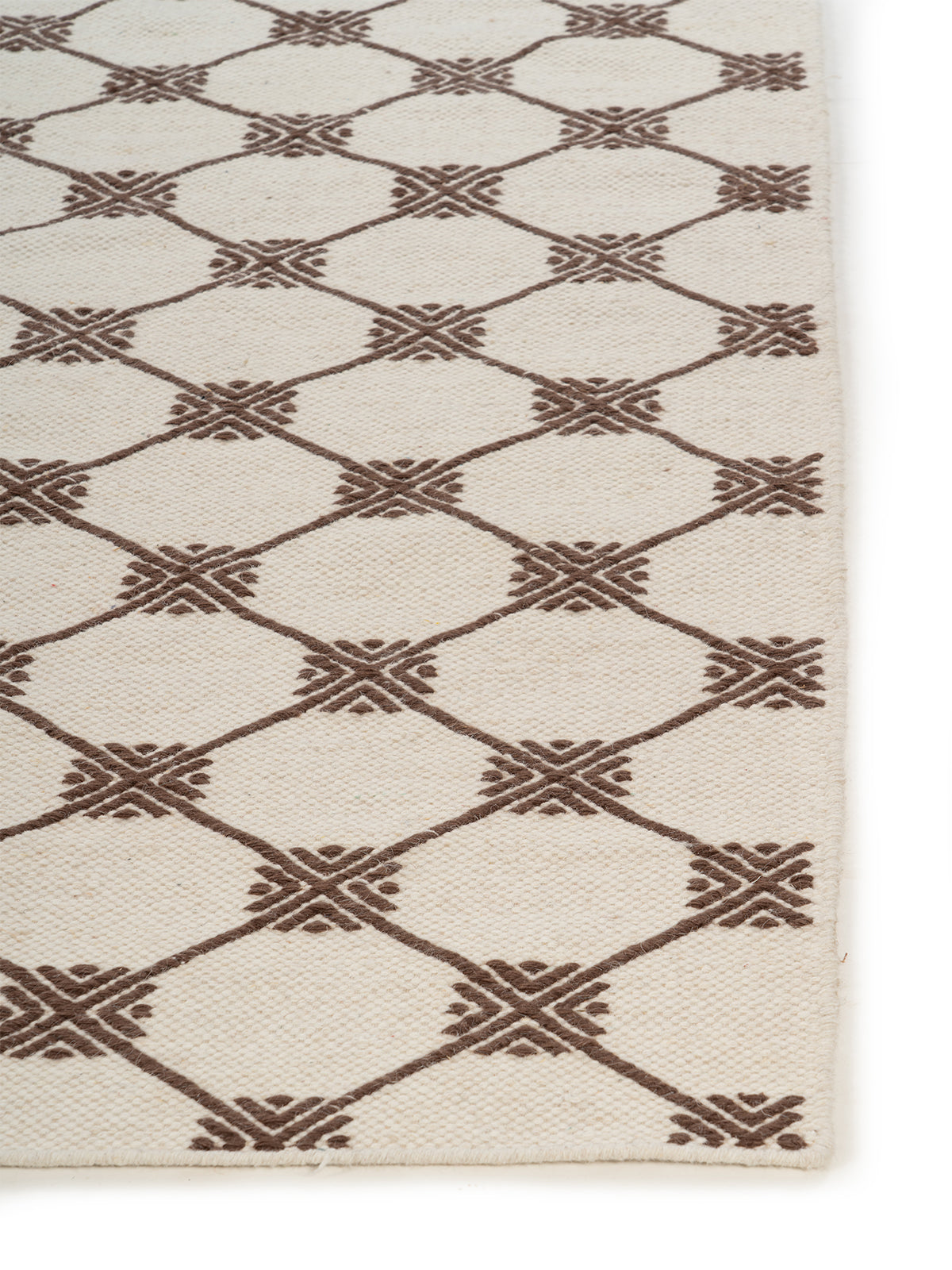 Geometric Trellis Wool Rug wool rug styled in a living room interior