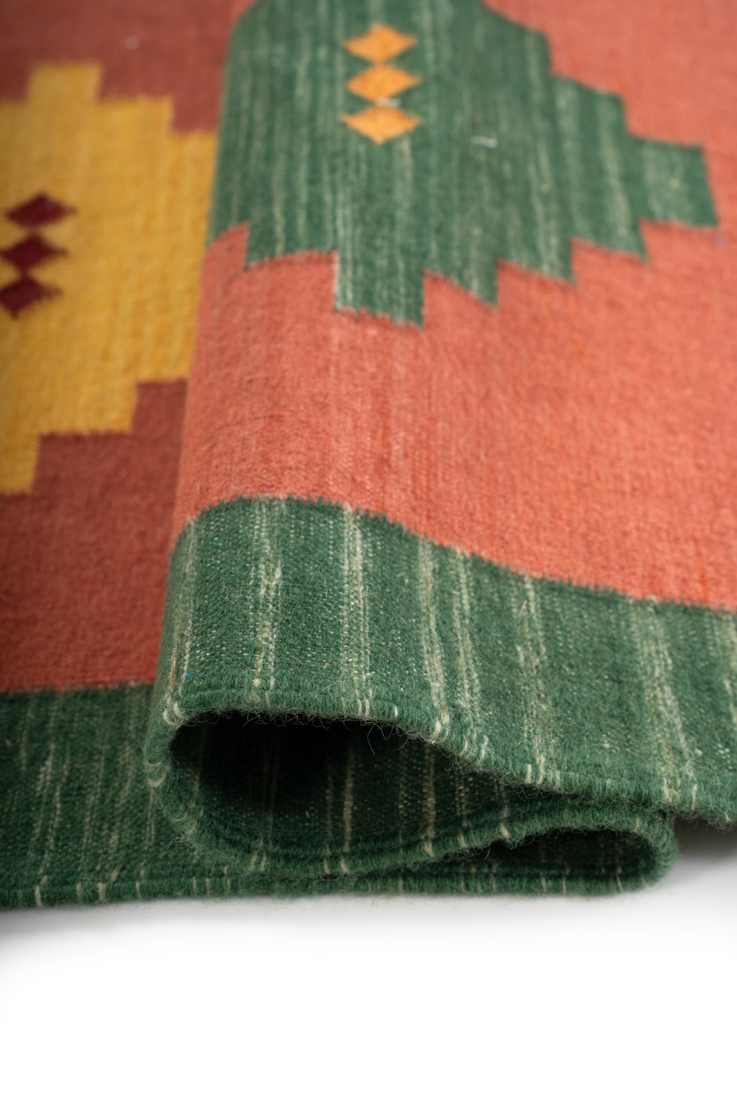 Heritage Mosaic Flatweave Wool Rug close-up showing the wool weave and traditional motif