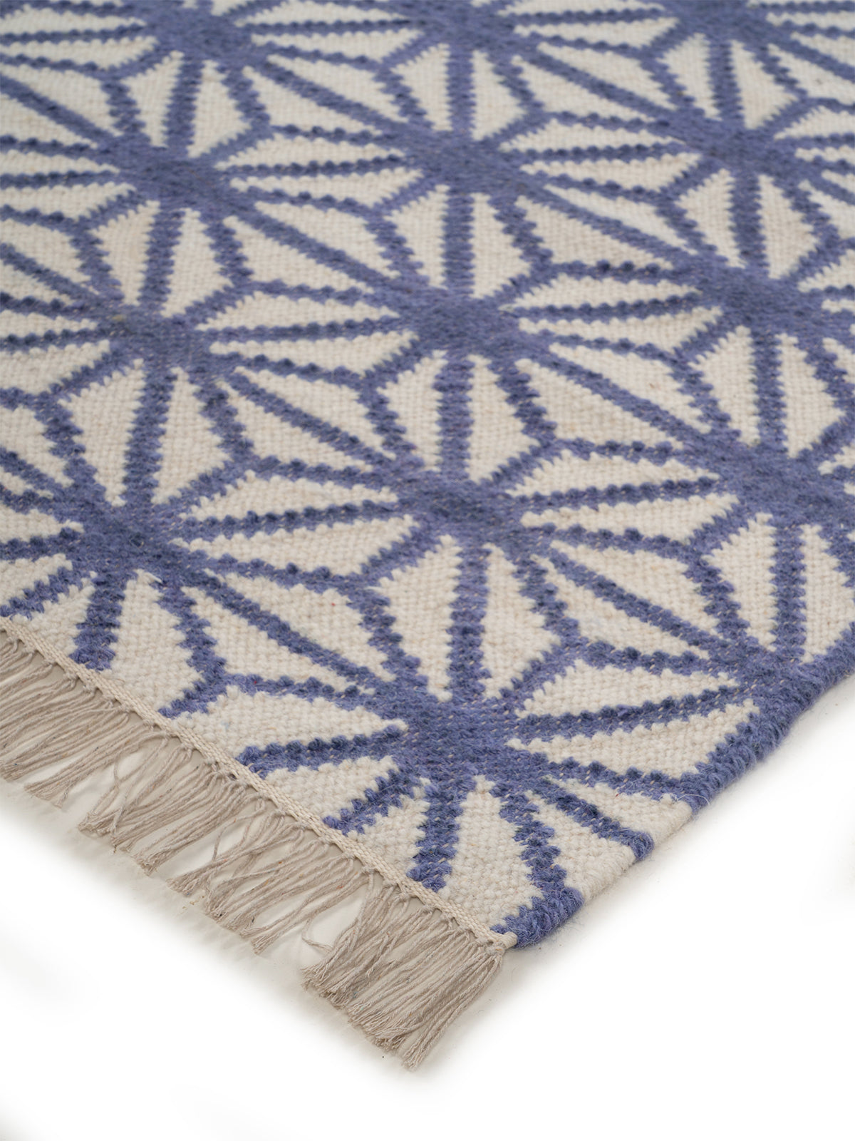 Indigo Starburst Flatweave Rug close-up showing the wool weave and geometric motif