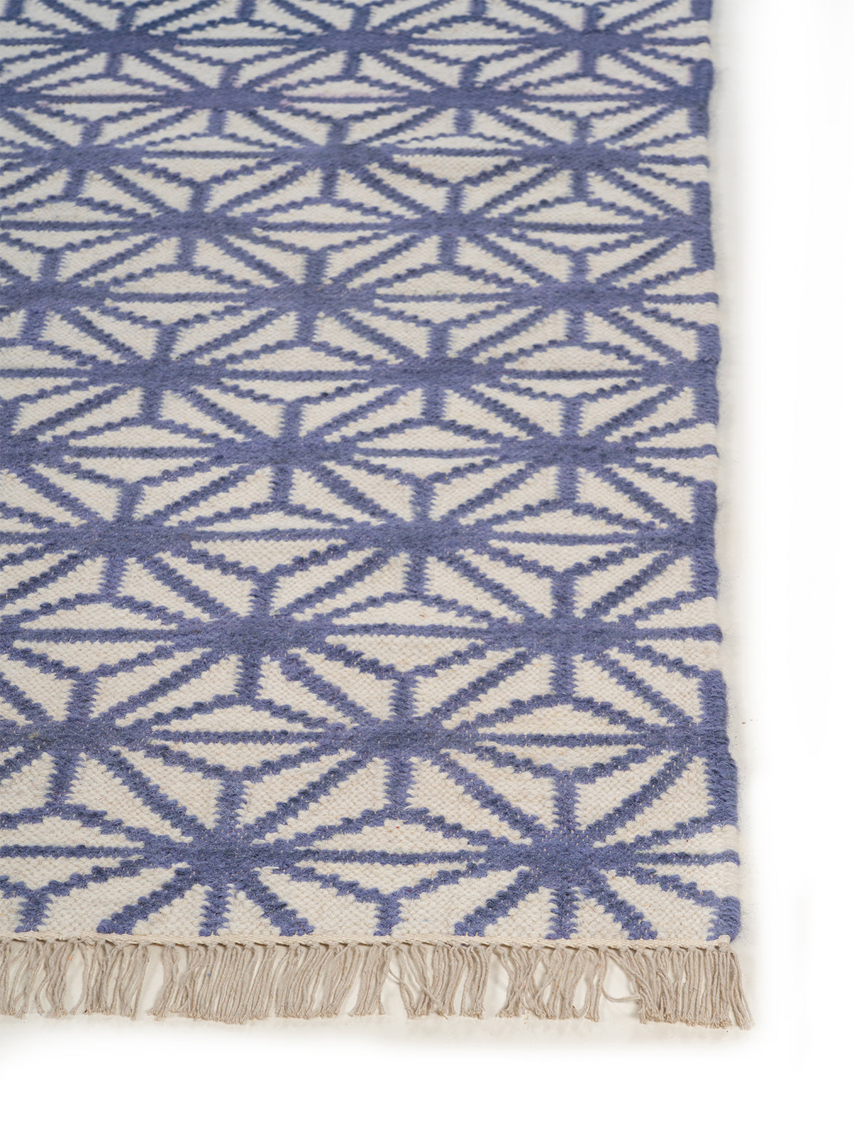 Indigo Starburst Flatweave Rug wool rug styled in a living room interior