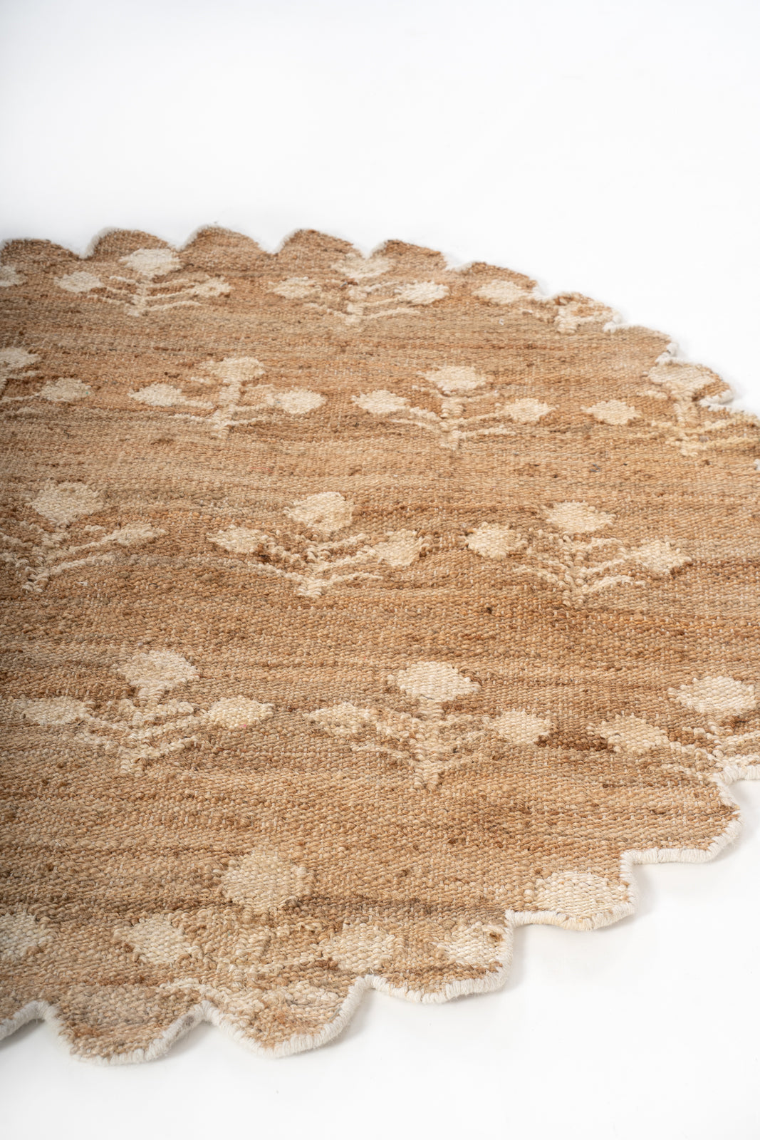 Ivory Bloom Scalloped Jute Rug close-up showing the jute weave and surface texture