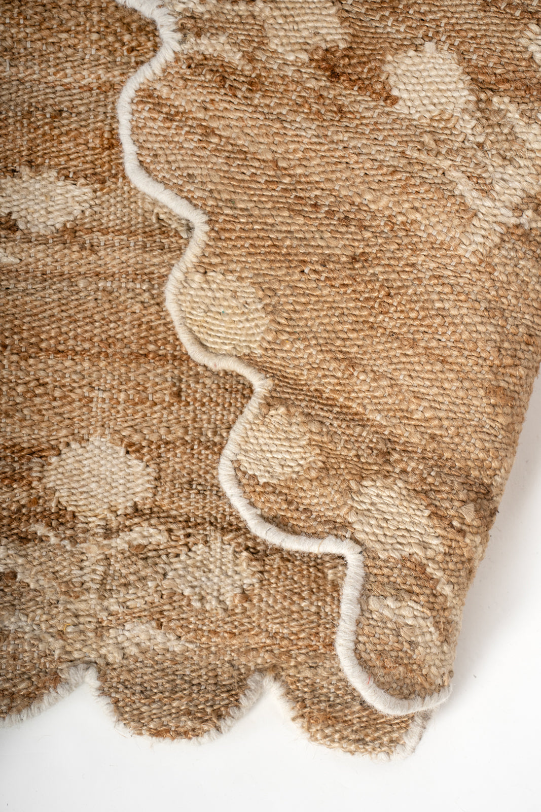 Ivory Bloom Scalloped Jute Rug detail showing the textured jute surface and finishing