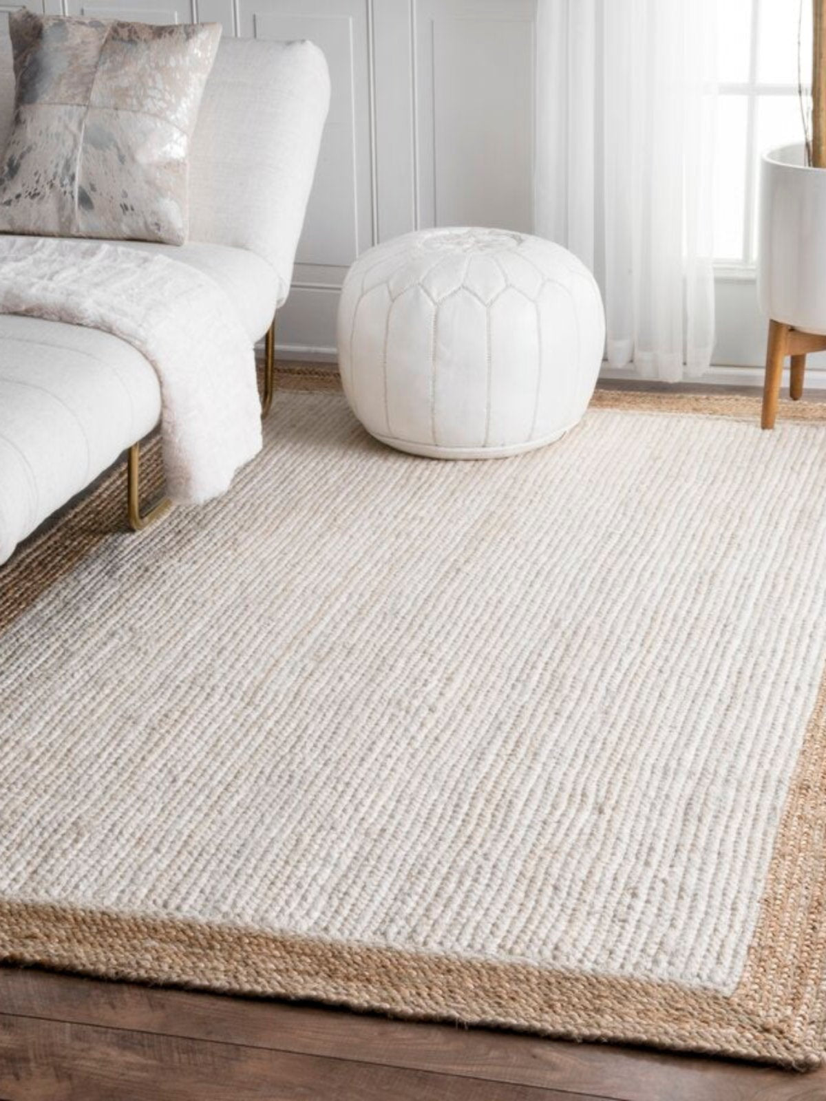 Juba jute bordered area rug-Ivory jute rug styled in a living room interior