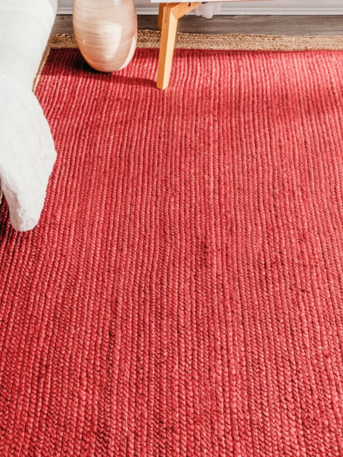 Juba jute bordered area runner-Red jute stair runner styled on a staircase in a designed interior
