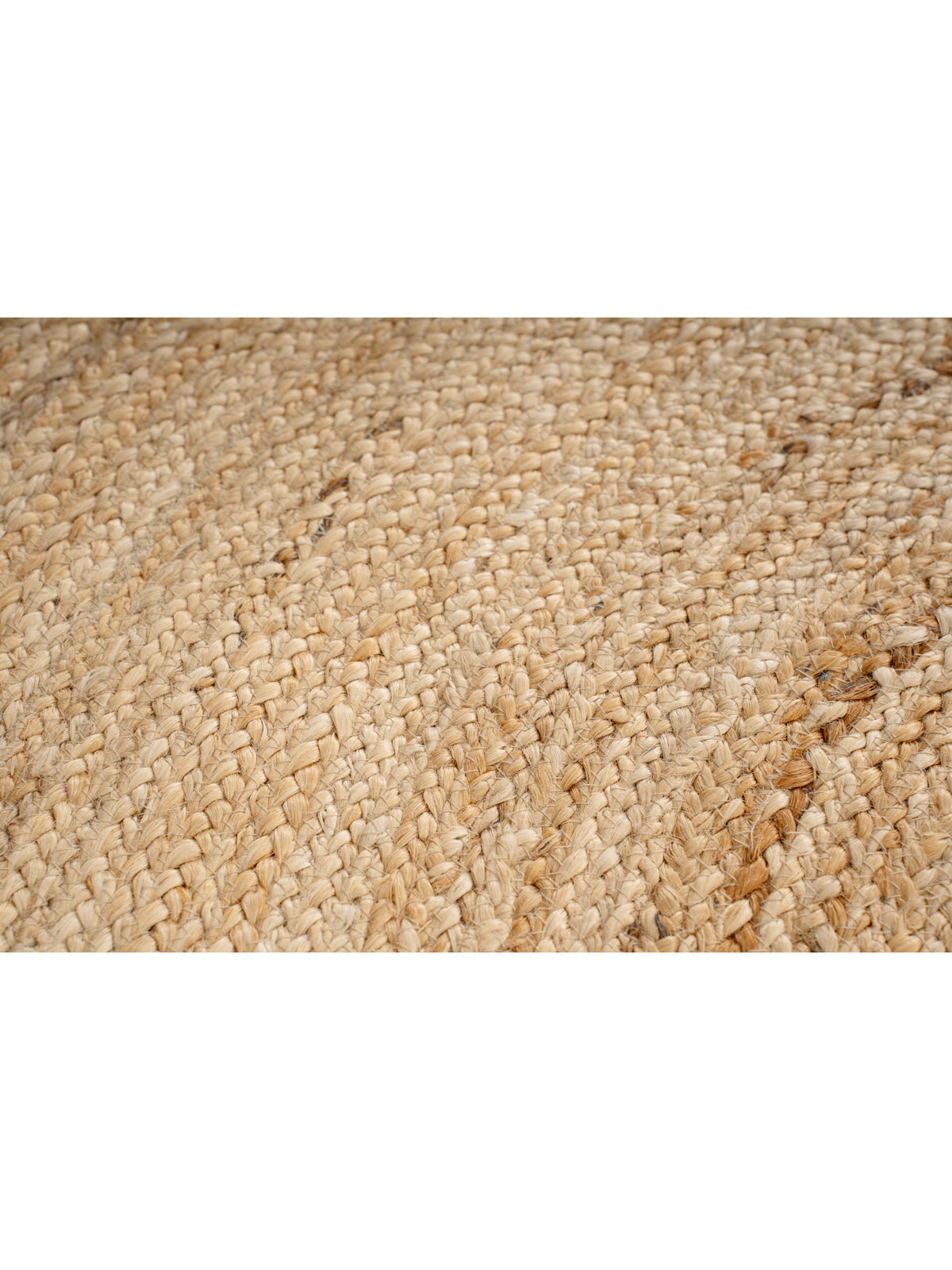 Kabwe round jute rug close-up showing the jute weave and surface texture