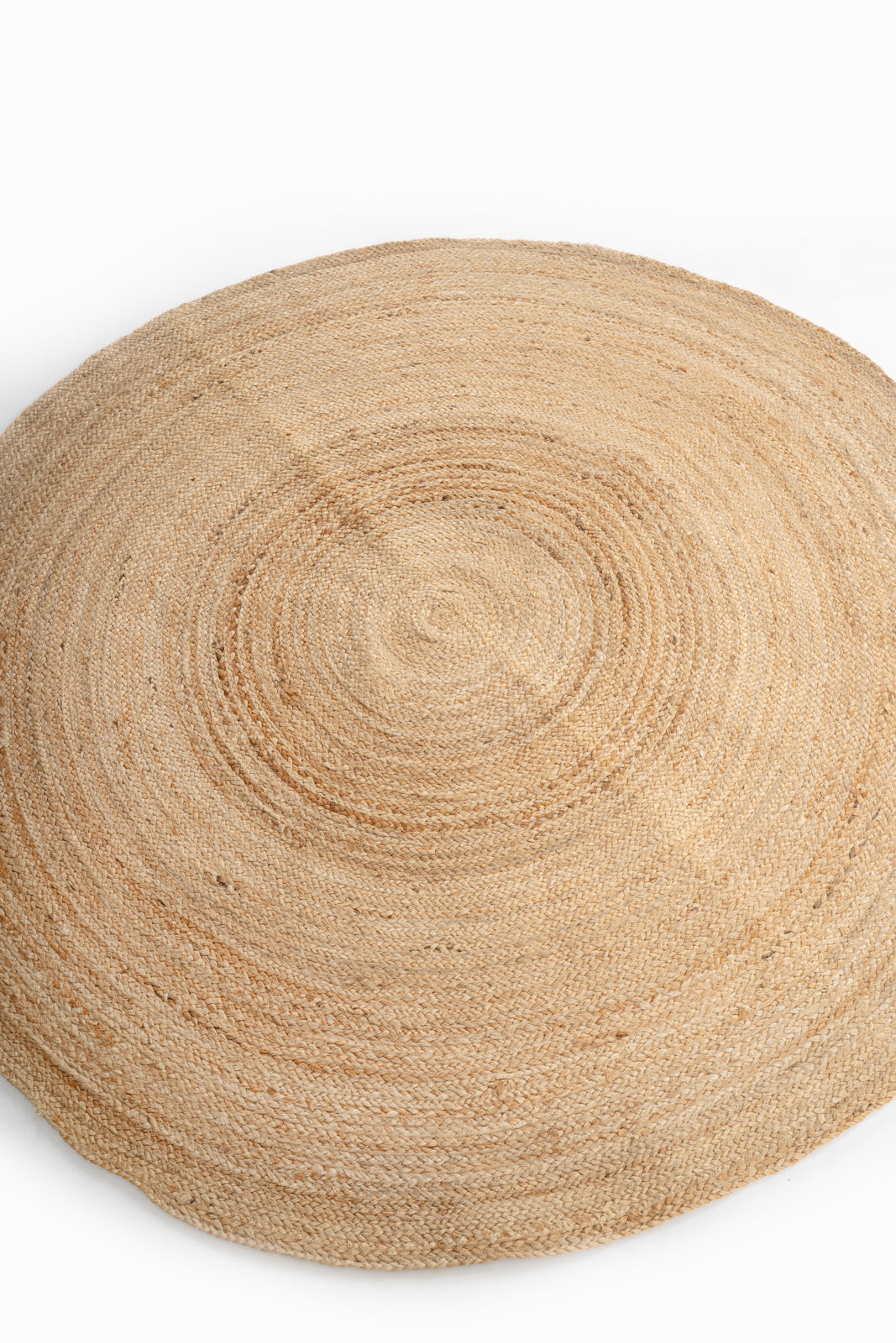 Kabwe round jute rug jute rug styled in a living room interior