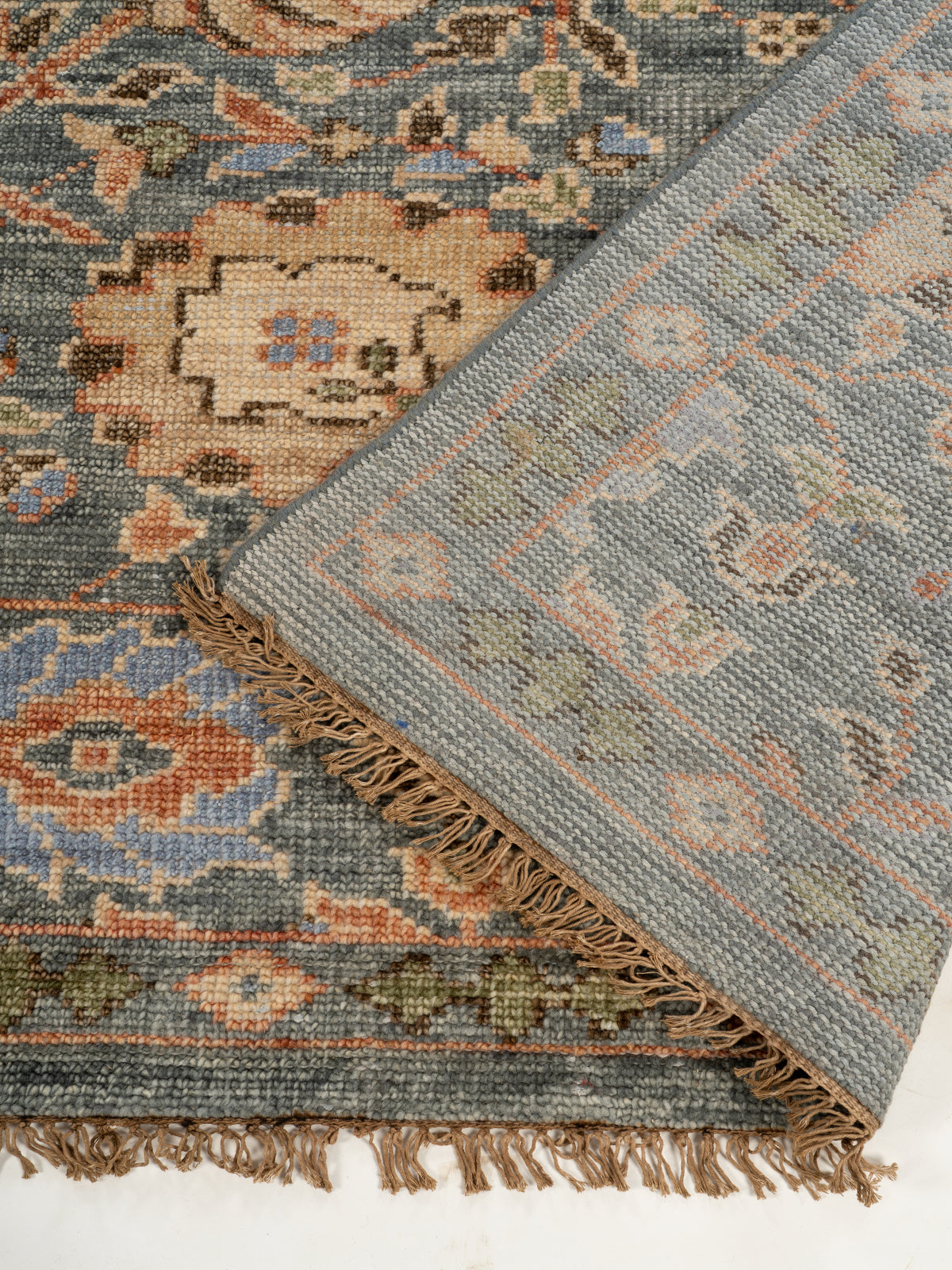 Kashmir Bloom Wool Rug detail of the floral motif in handspun wool cut pile