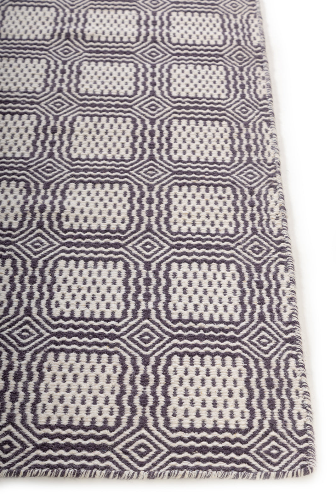 Kentmere Wool Flatweave wool rug styled in a living room interior