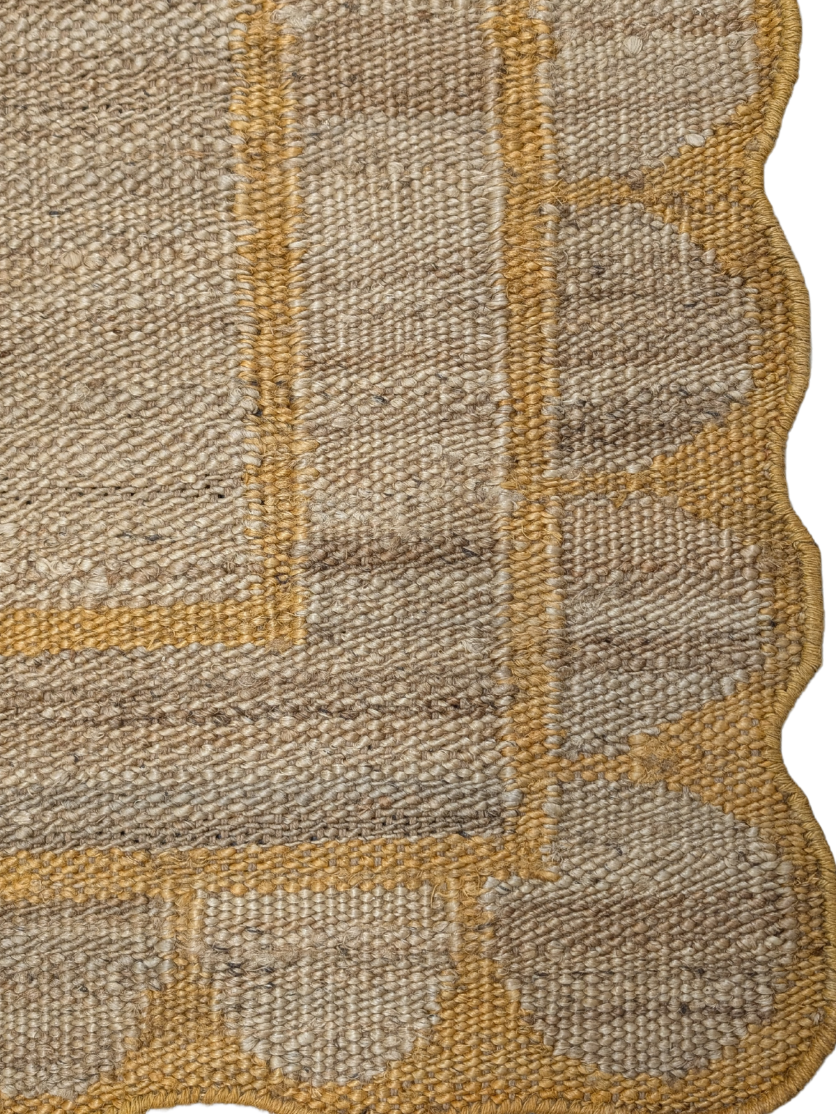 Kigali scalloped hemp rug- Mustard hemp rug styled in a living room interior