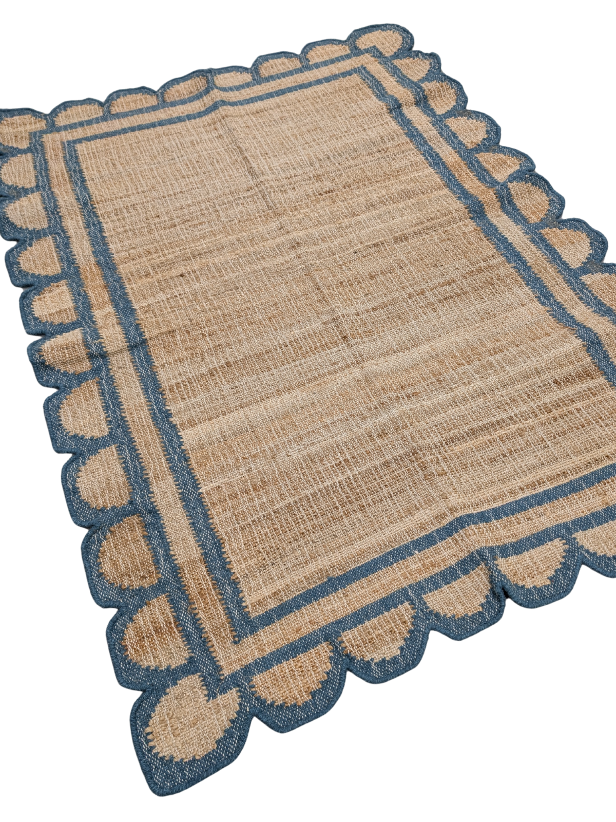 Kigali scalloped hemp rug-Navy hemp rug styled in a living room interior