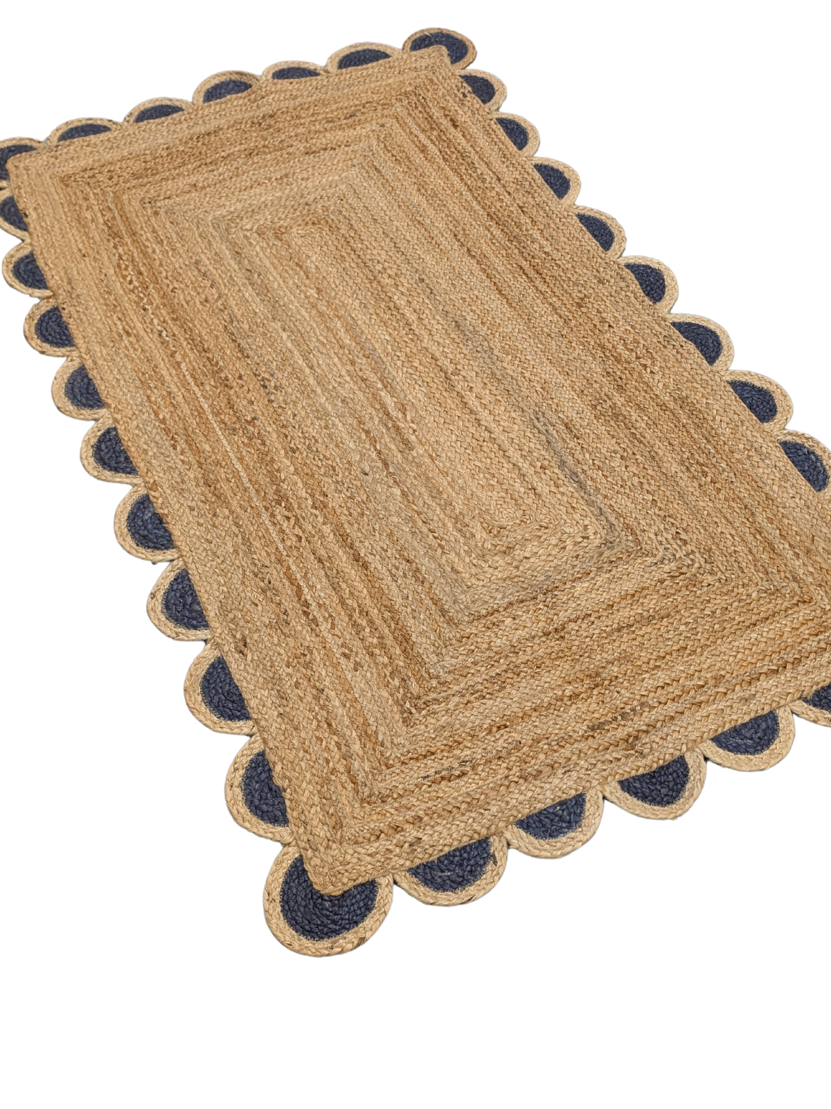 Kribi scalloped jute area rug-Navy jute rug styled in a living room interior