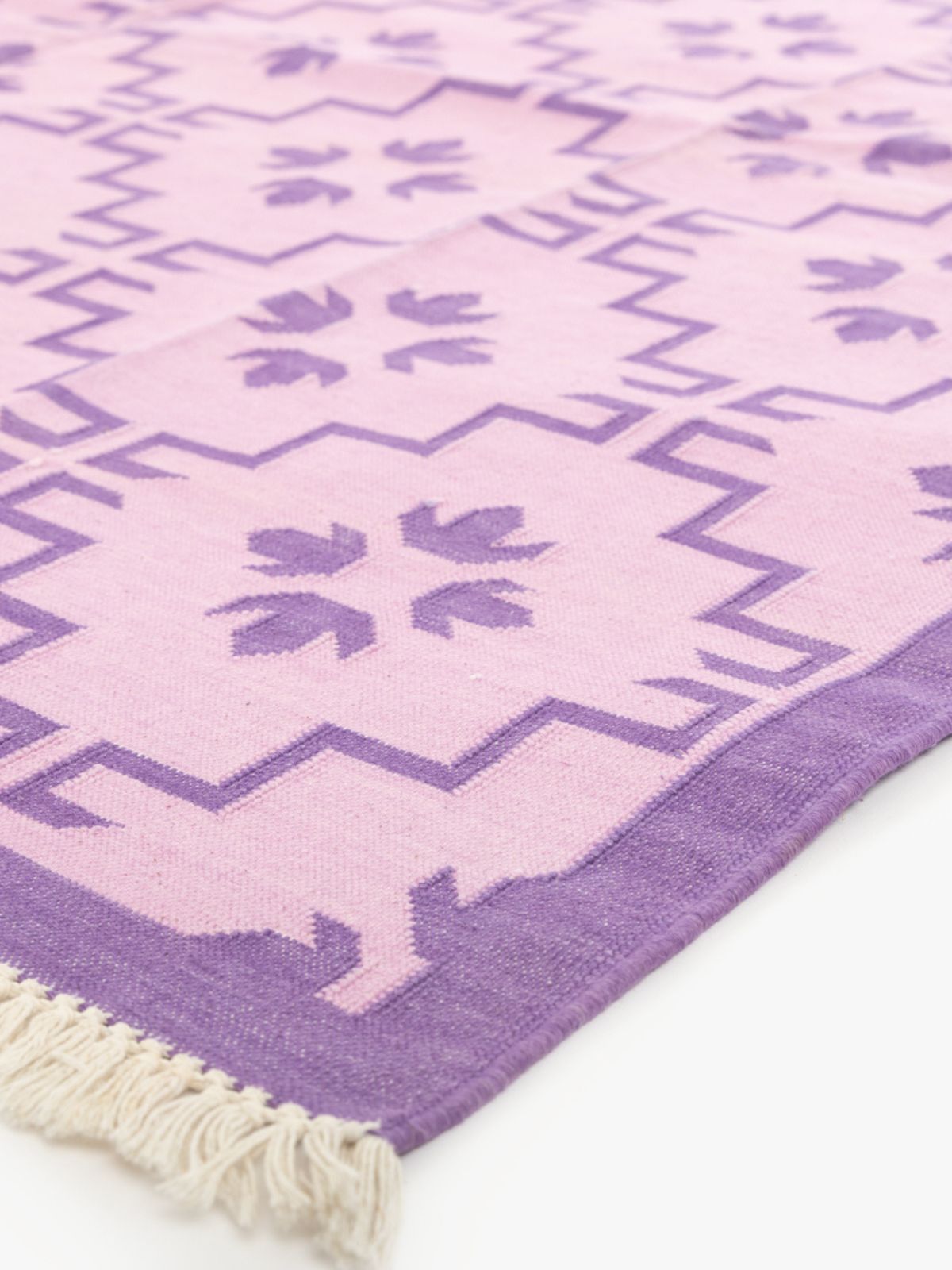 Lilac Majesty close-up showing the cotton pile and floral motif