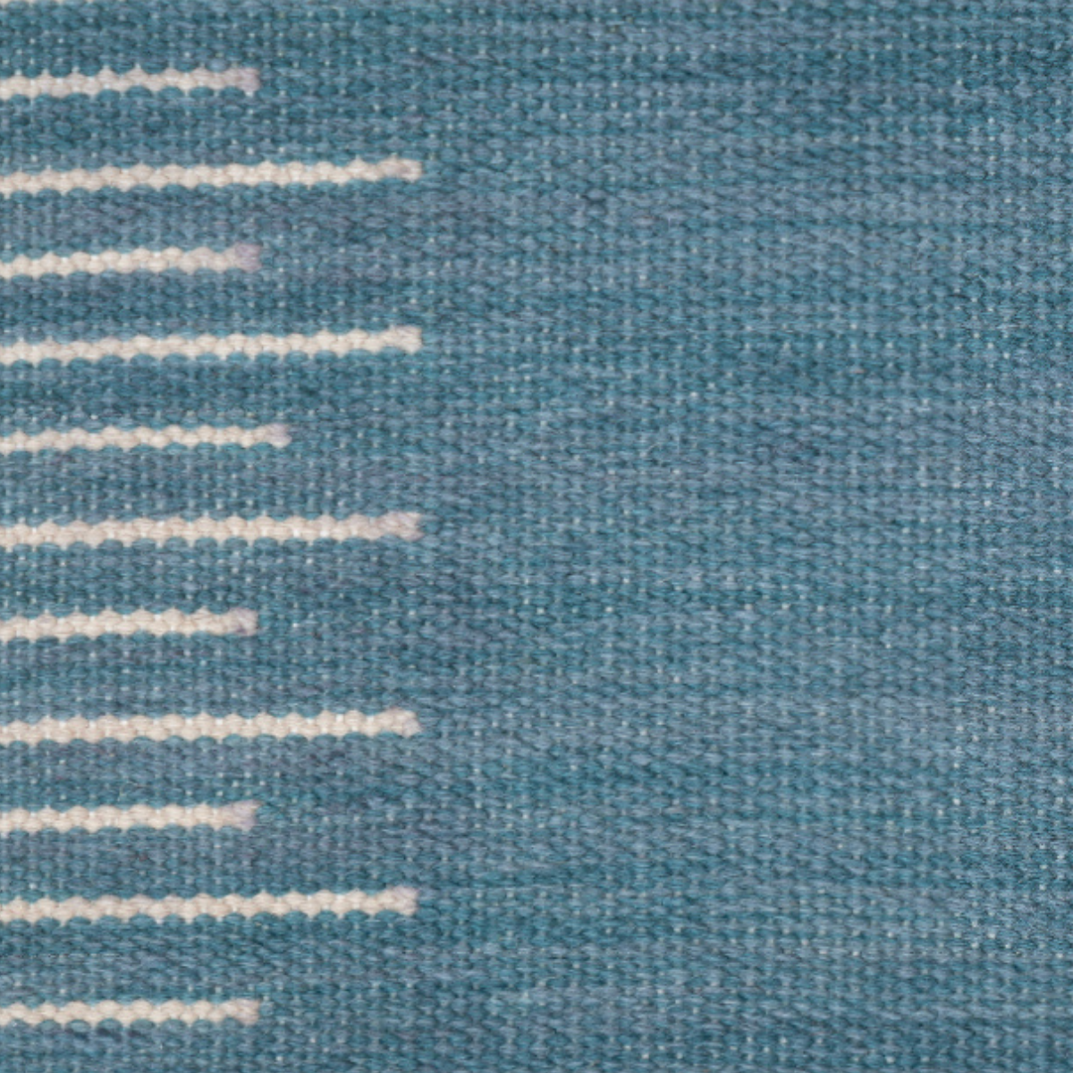 Linear Grid : Slate Tide close-up showing the wool weave and geometric motif