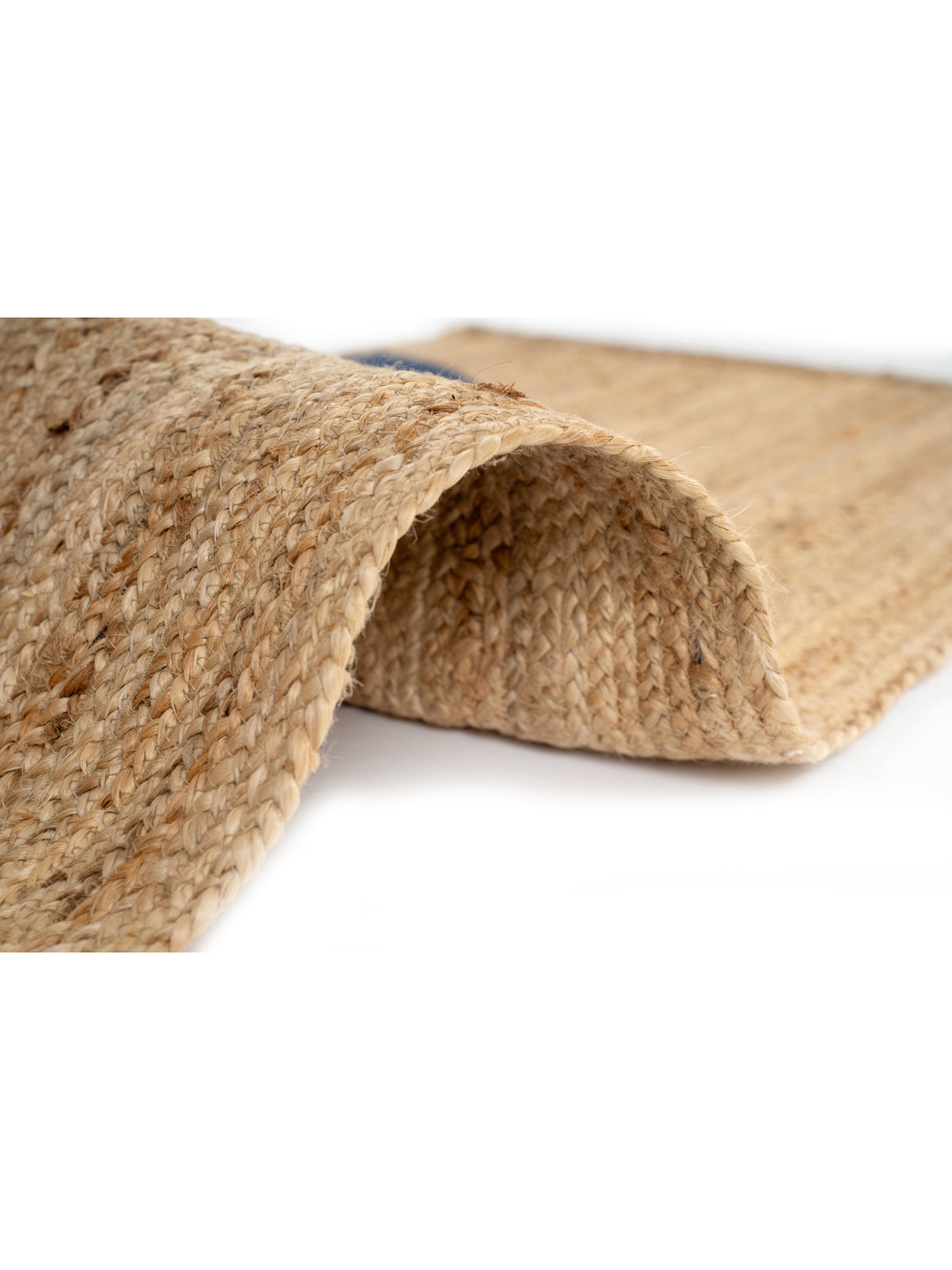 Lira runner rug detail showing edge binding and hemp finishing of the runner