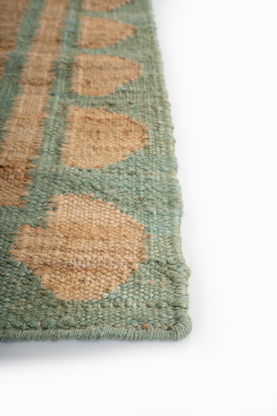 Lira scalloped hemp rug-Green - hemp runner laid in a hallway view