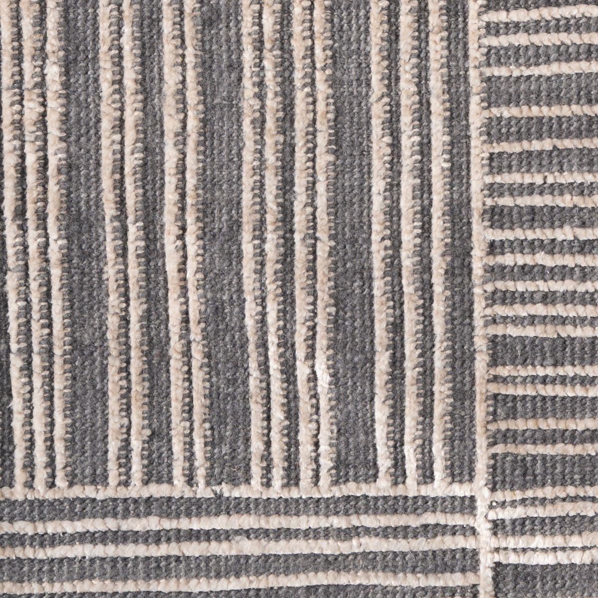 Lithos Edit : Flint & Stone close-up showing the bamboo silk weave and geometric motif
